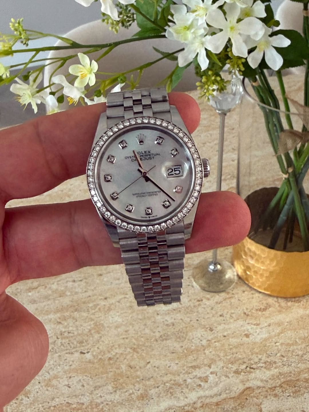 May be an image of wrist watch and text