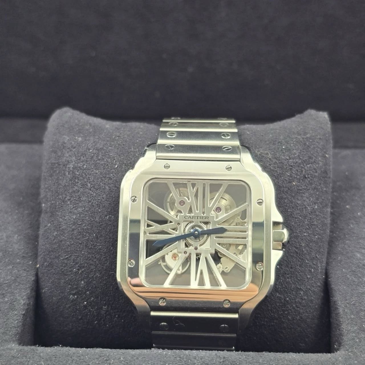 May be an image of wrist watch and text that says 'ی H + CARTIER AR ME IER C O'