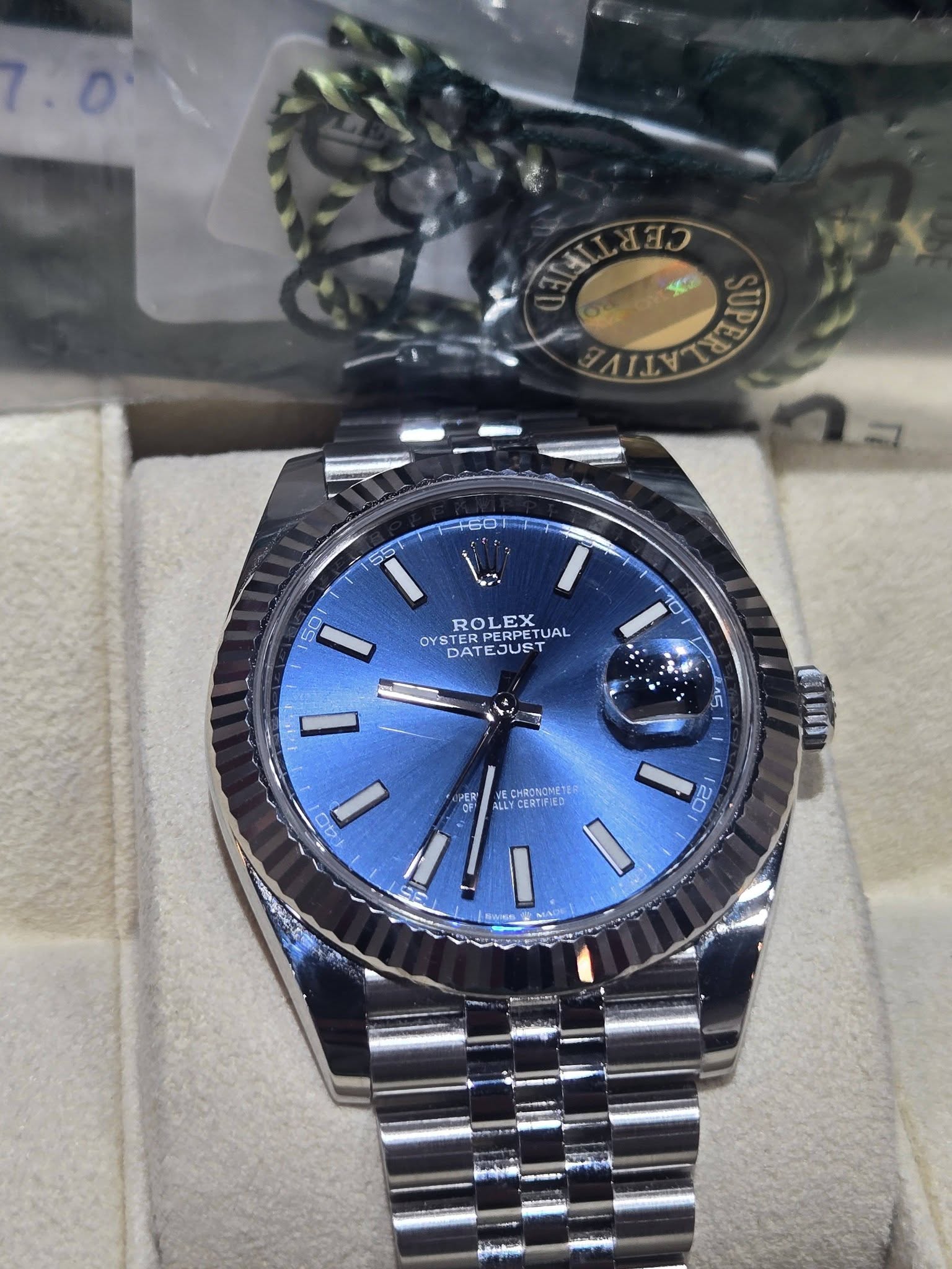 May be an image of wrist watch and text