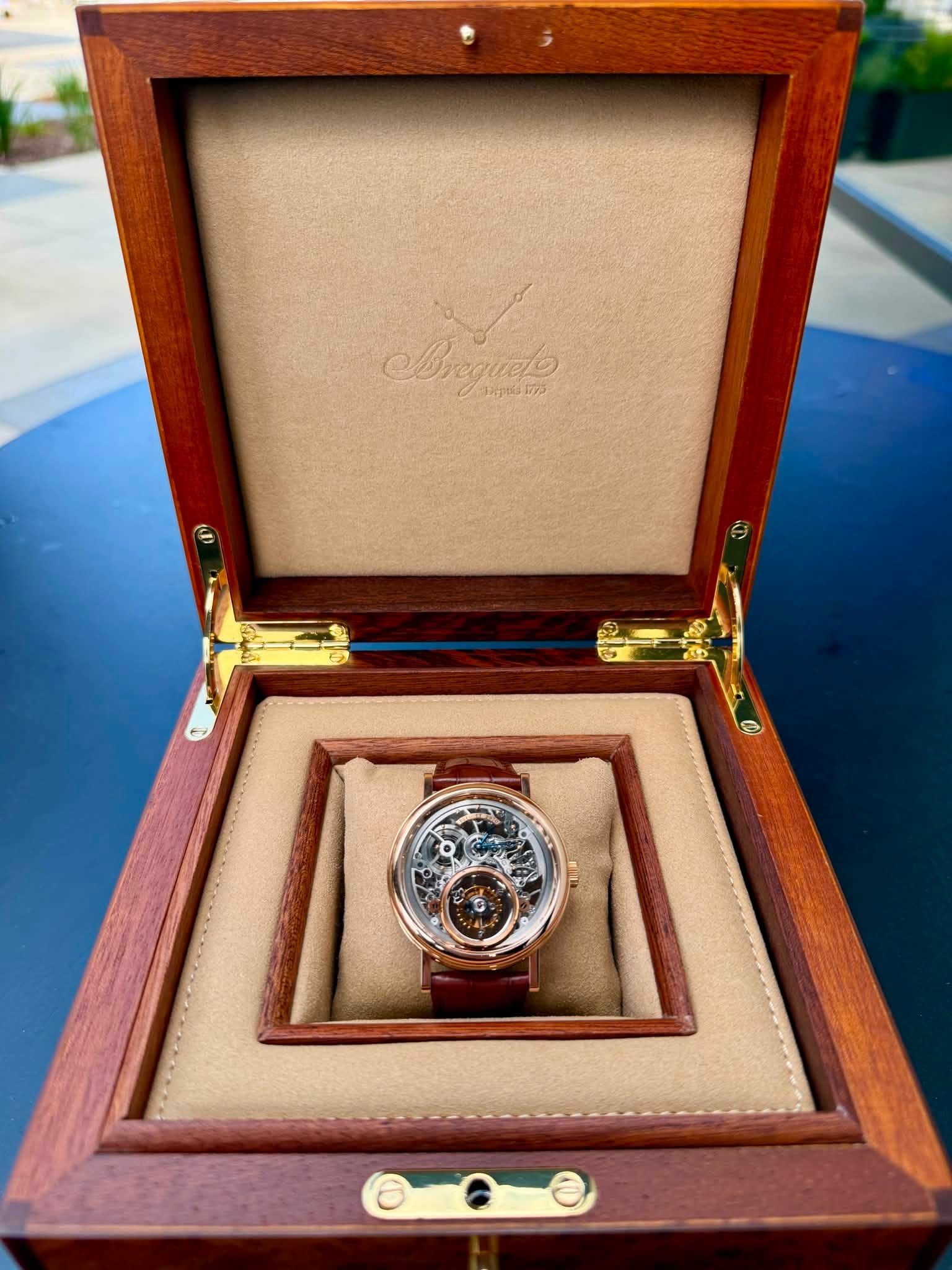 May be an image of wrist watch and text