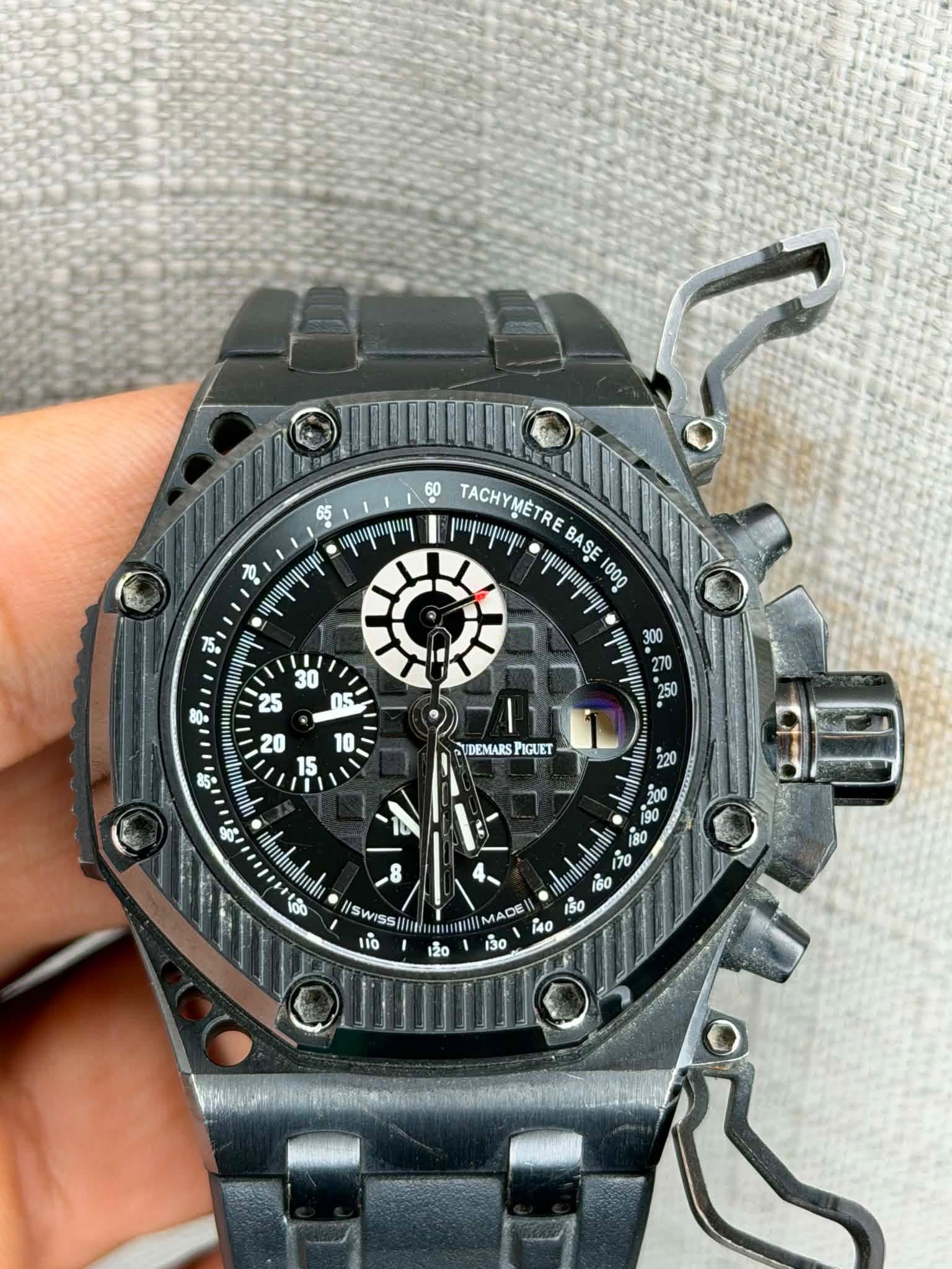 May be an image of wrist watch and text