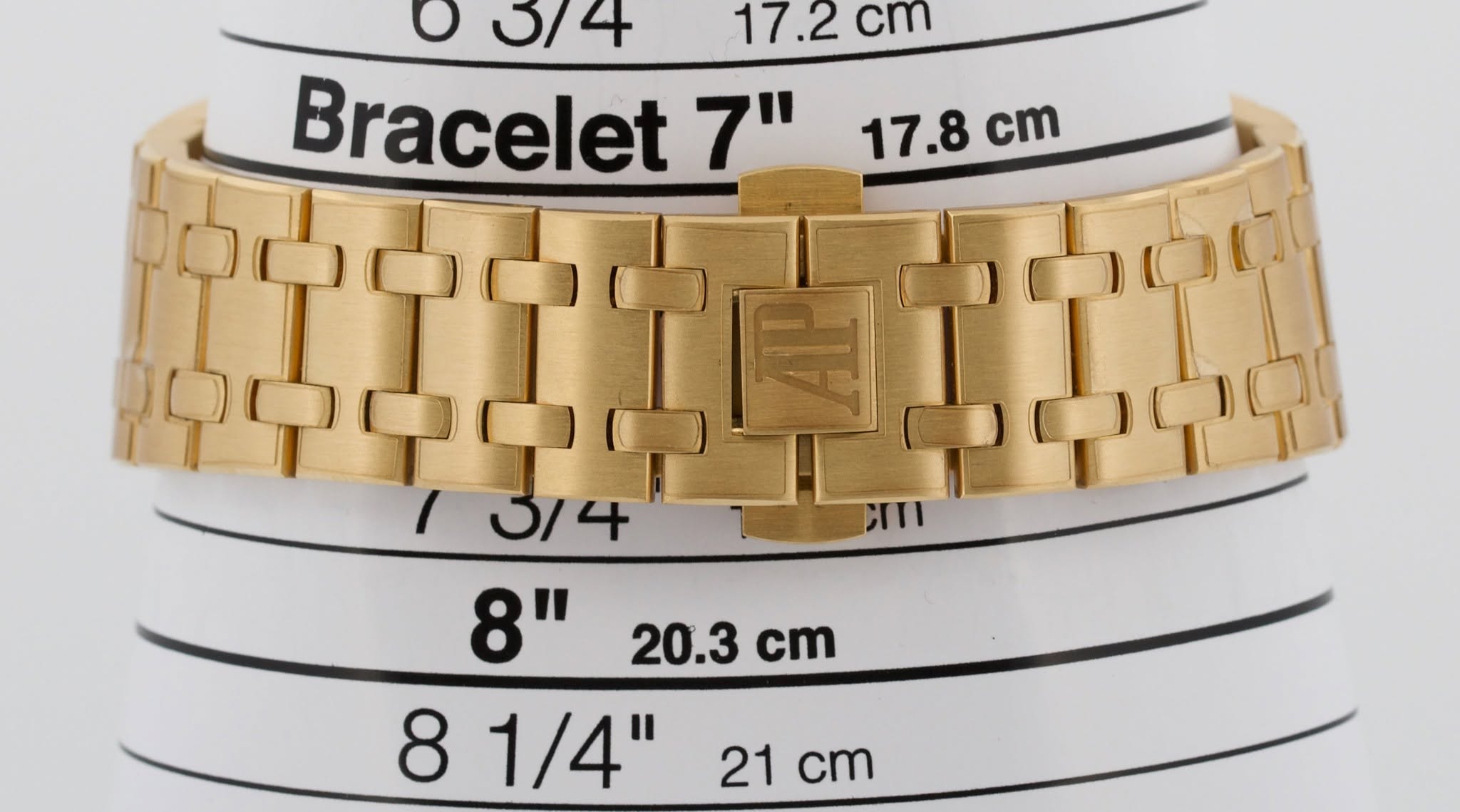 May be an image of jewelry, wrist watch and text