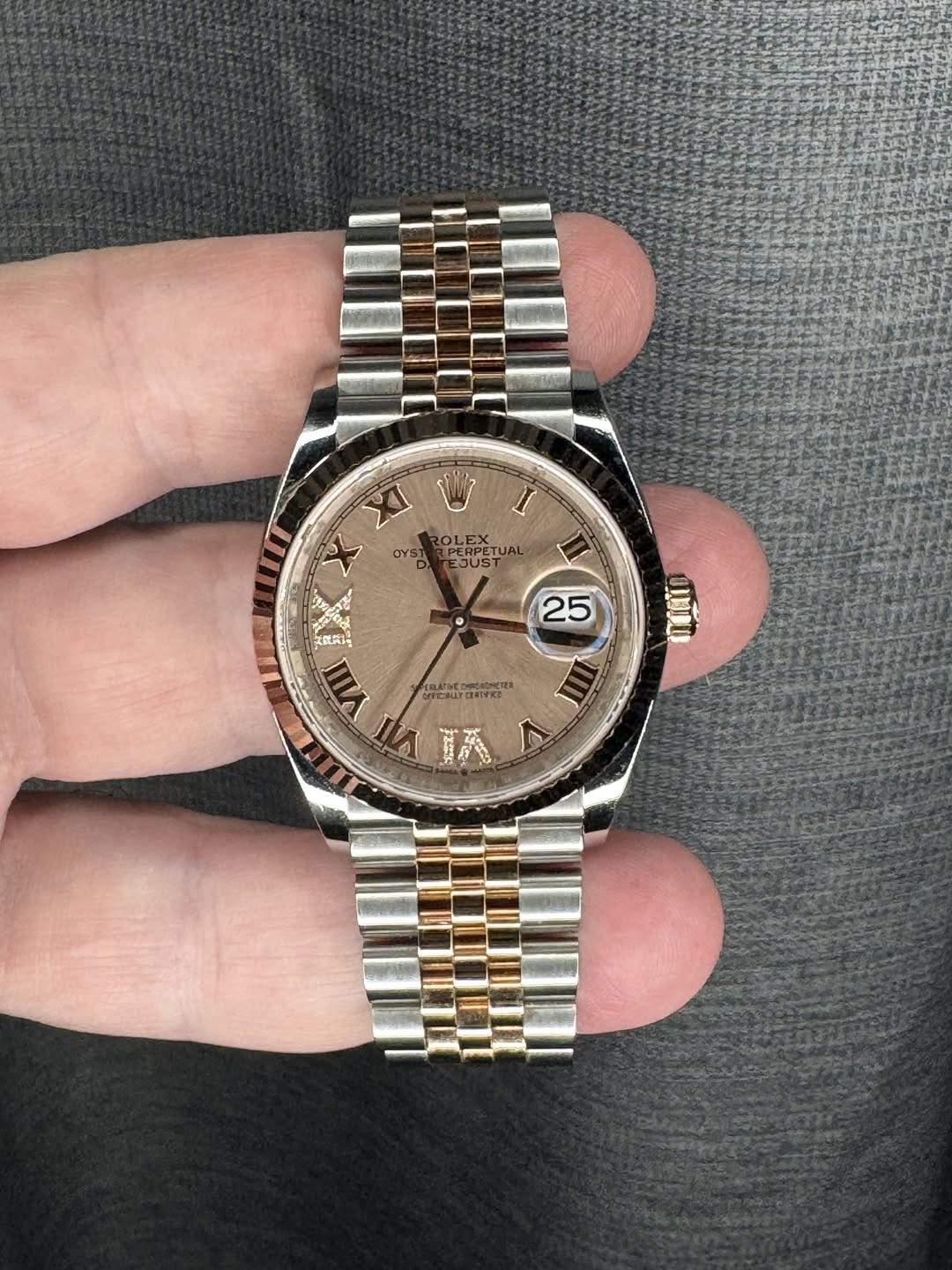May be an image of wrist watch and text