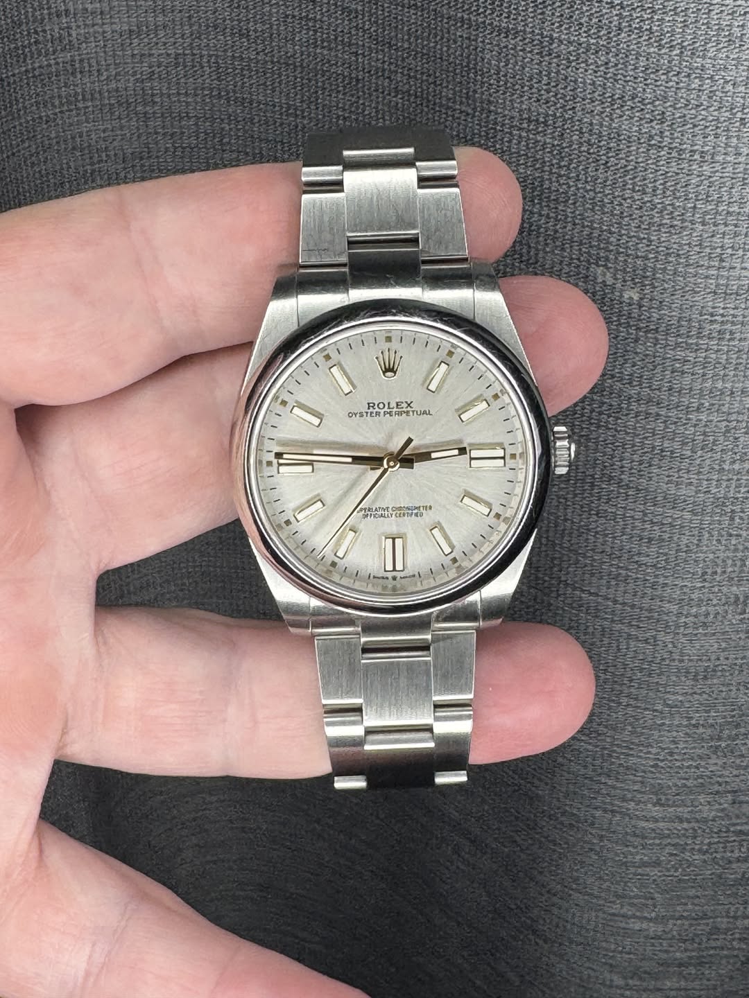 May be an image of wrist watch and text