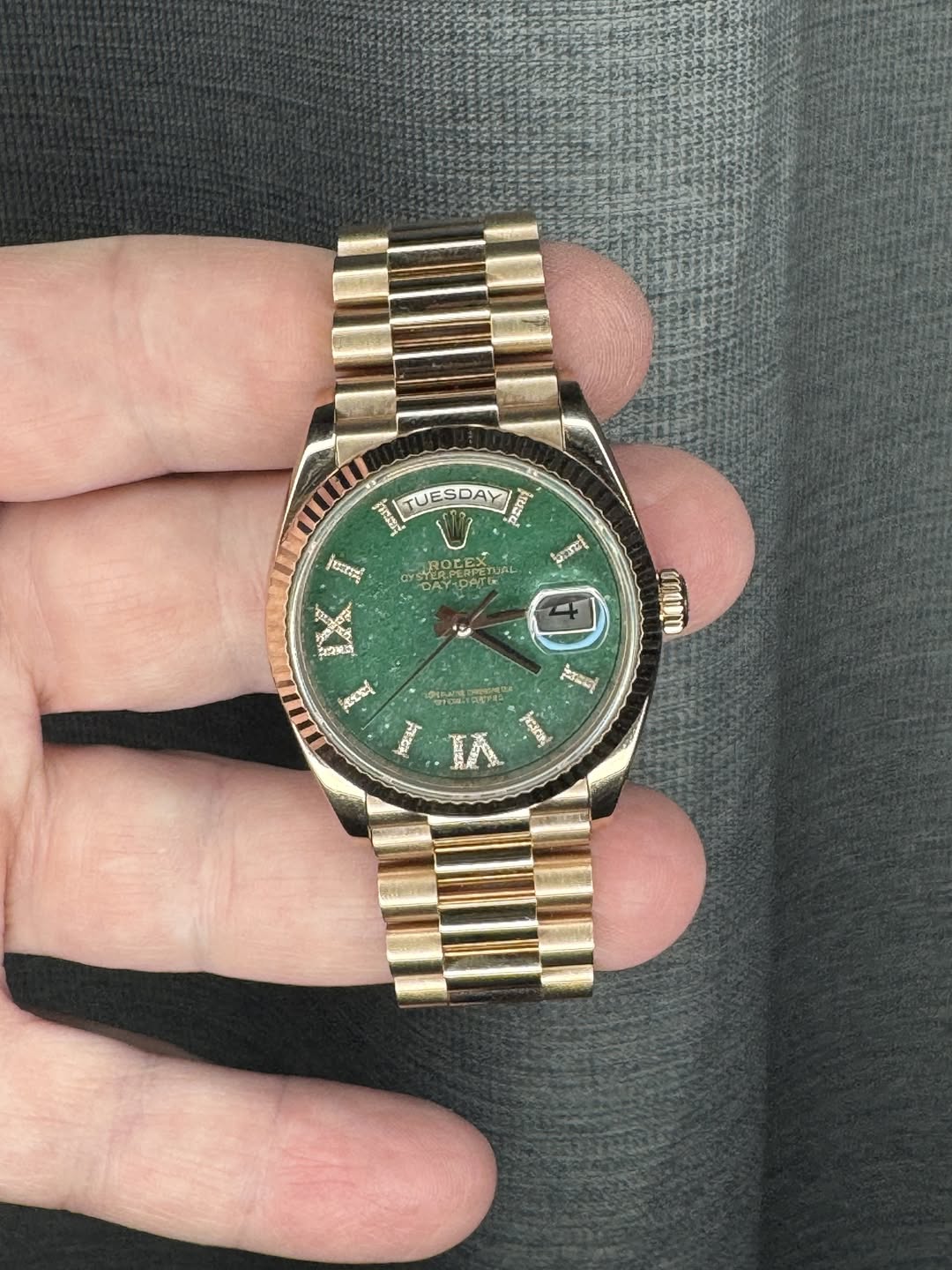 May be an image of wrist watch and text