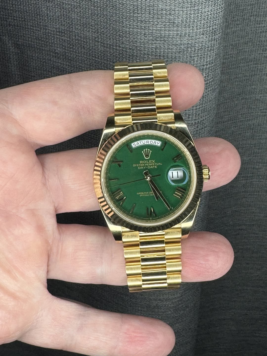 May be an image of wrist watch and text