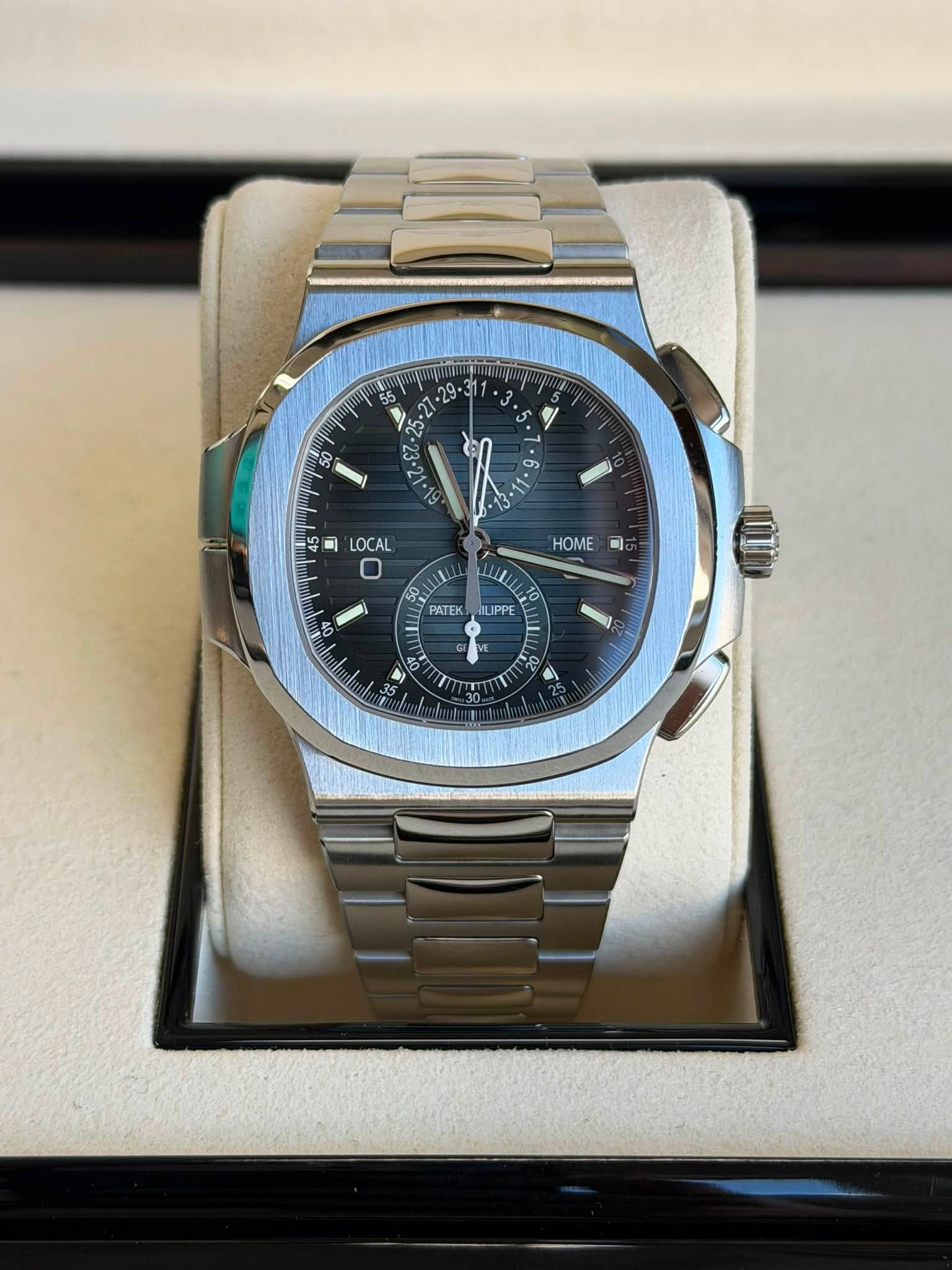 May be an image of wrist watch and text that says ' . N 8 미 LOCAL HOME 미 8 PATEK 0V LIPPE PPE'