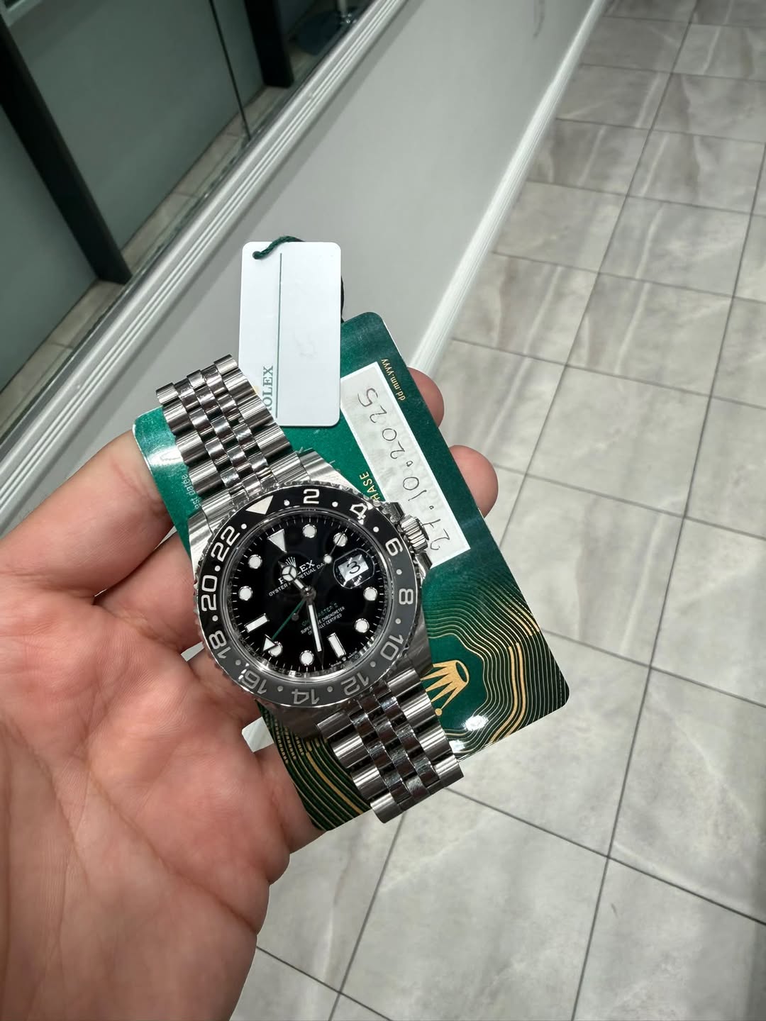 May be an image of wrist watch and text