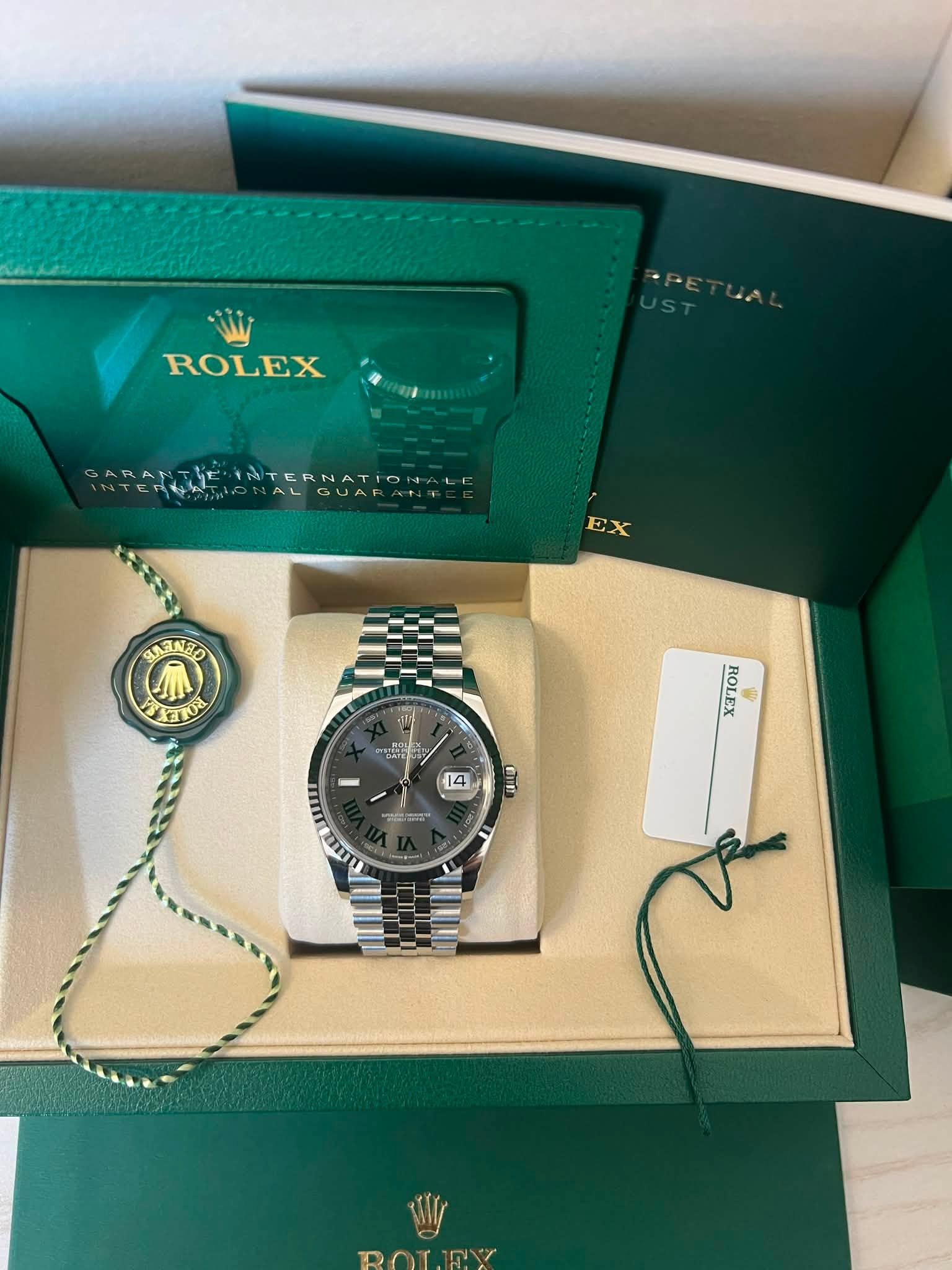 May be an image of wrist watch and text