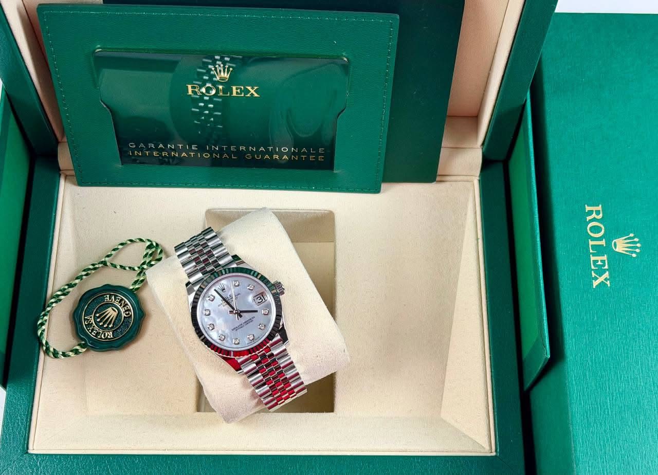 May be an image of wrist watch and text that says 'ROLEX ROI EX GARANTIEINTERNATION GARANTIE INTERNATIONTERNATION IN ERNATIO NTERNATIO ይ LAEA ENE A ඕ ل ยวอนี ΤΟν 후 10 ROLEX…