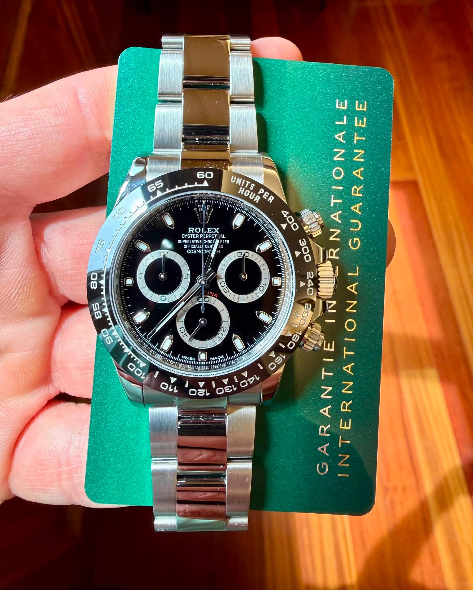May be an image of wrist watch and text that says '60 65 ROL ROLEX EX SUPERLATING OYSTERPER ا COSMOS COstos の O 입랑 UNITS HOUR PER 00 Oσε GUARANTEE A 042 RNATIONALE…