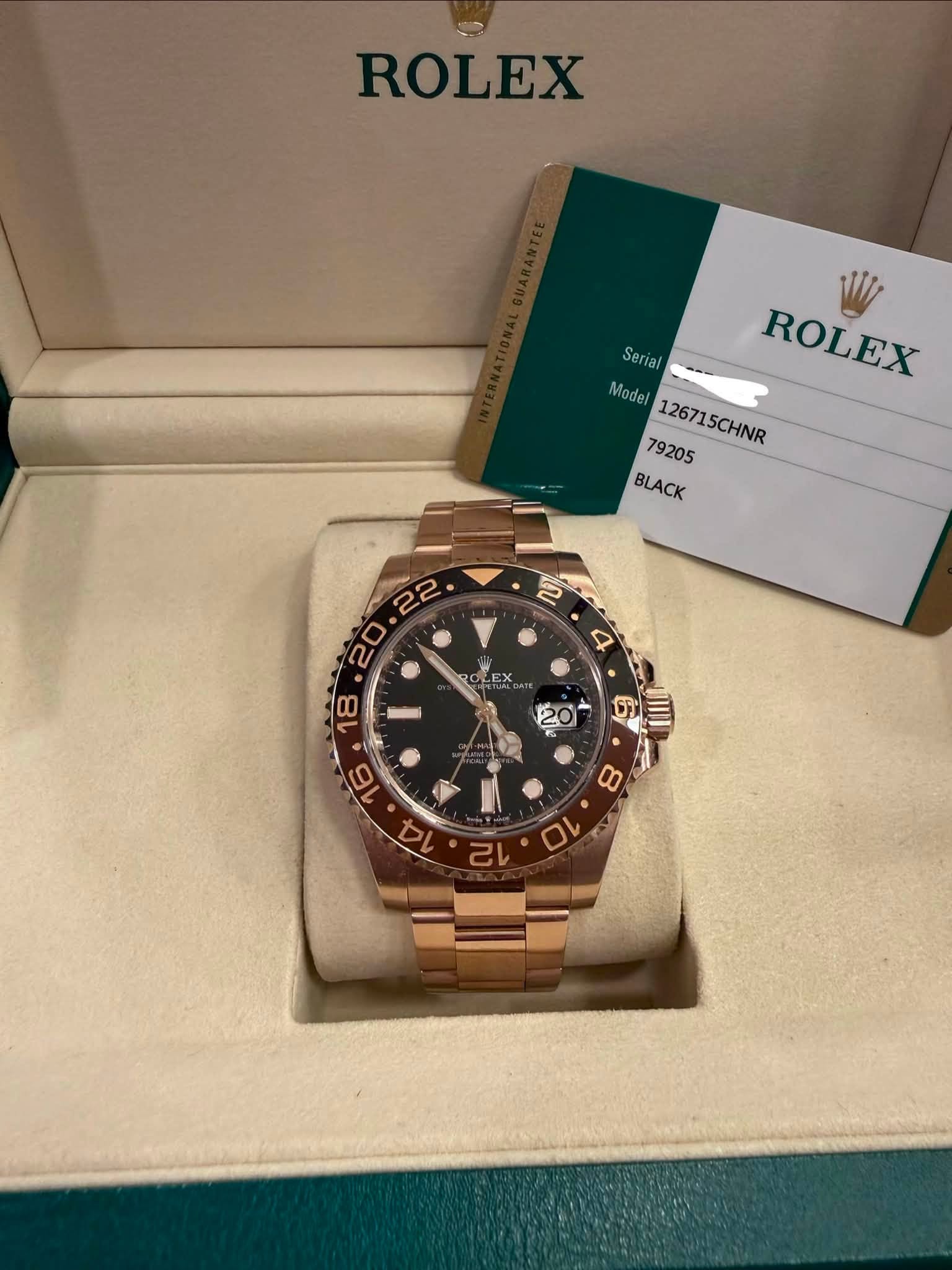 May be an image of wrist watch and text that says 'ROLEX Serial ROLEX ROLEX Model del126715CHNR 79205 126715CHNR BLACK '