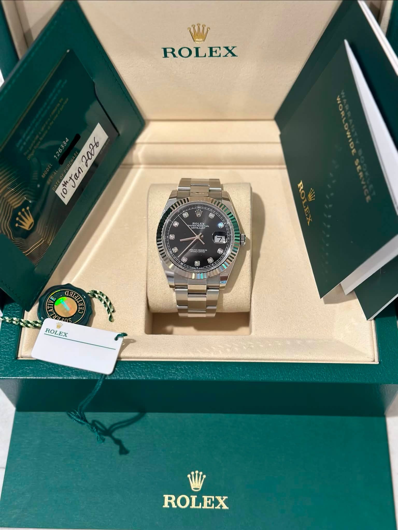May be an image of wrist watch and text