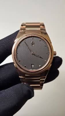 May be an image of wrist watch, jewelry and text