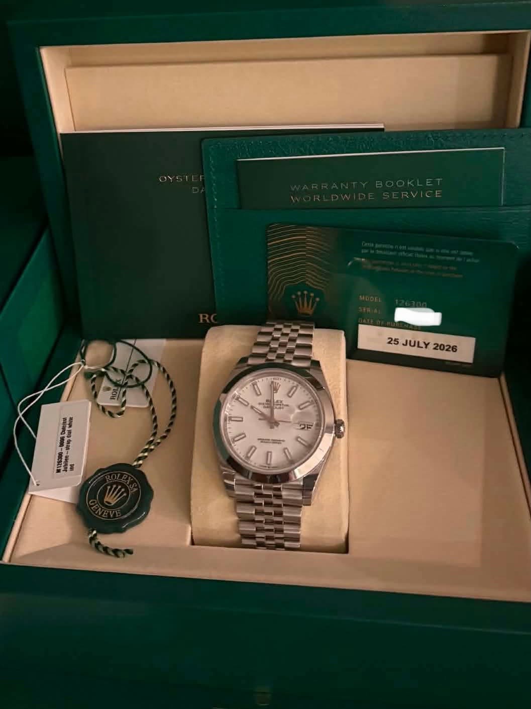 May be an image of wrist watch and text that says '25 JULY 25JULY2026 2026 佟 I cK U 銉曘伀 鄄 0'