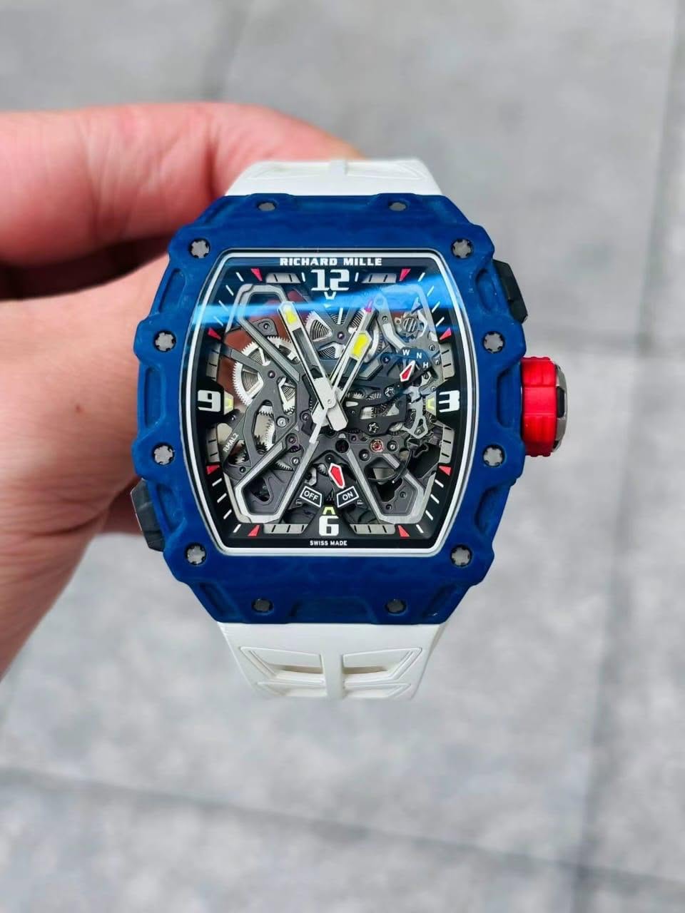 May be an image of digital watch and text that says 'RICHARO MILLE E A בביב 크로 ይ RMAL2 12 อา ن 6 OFF ON SWISS WISSMADE ADE'