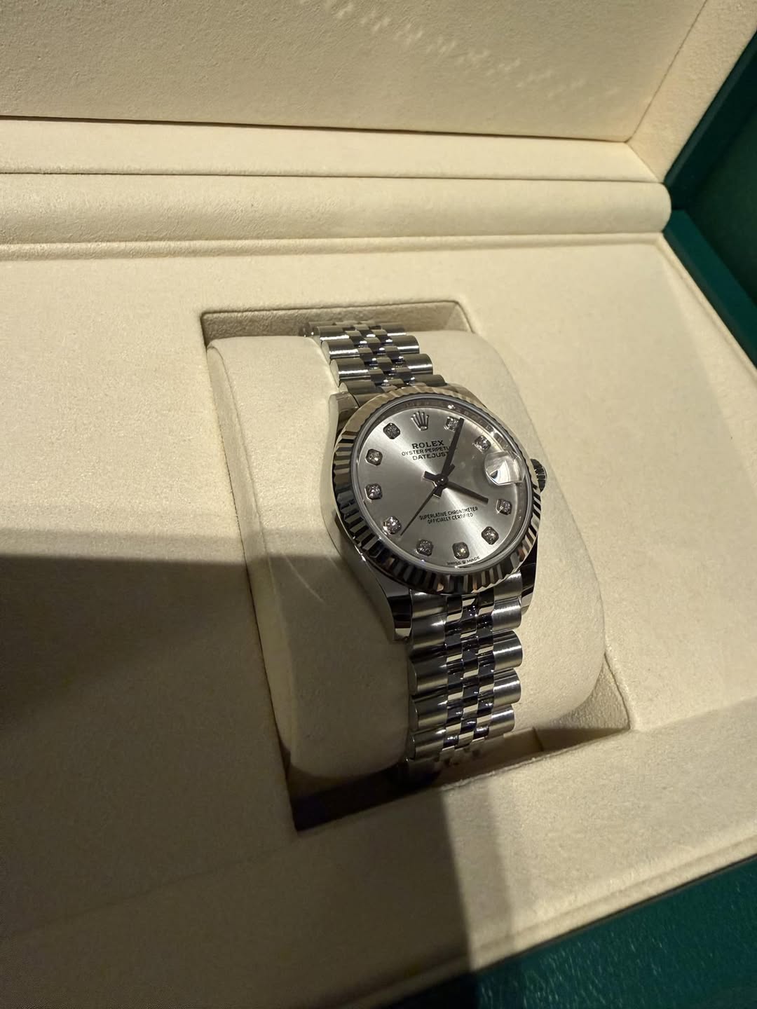 May be an image of wrist watch and text