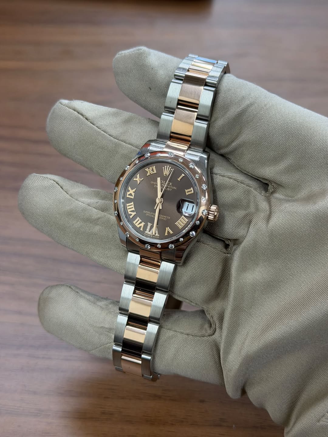 May be an image of wrist watch and text