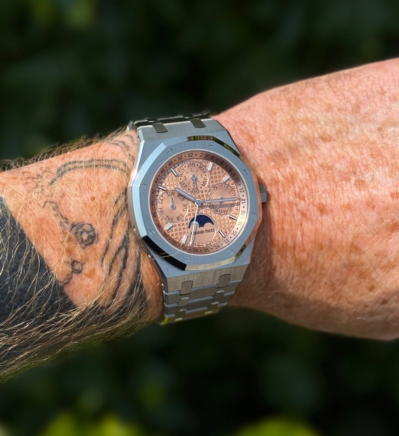 May be an image of wrist watch and text