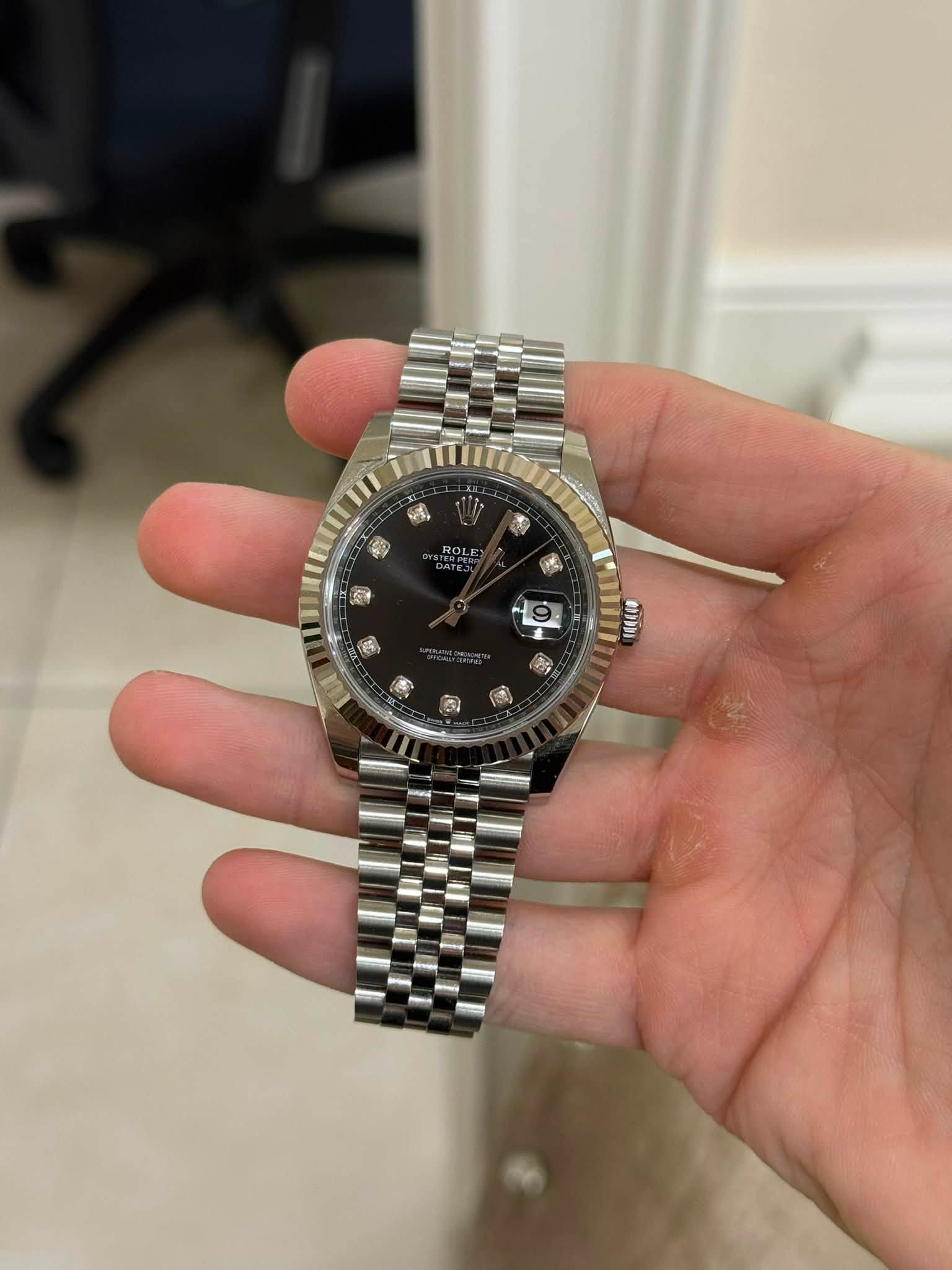 May be an image of wrist watch and text