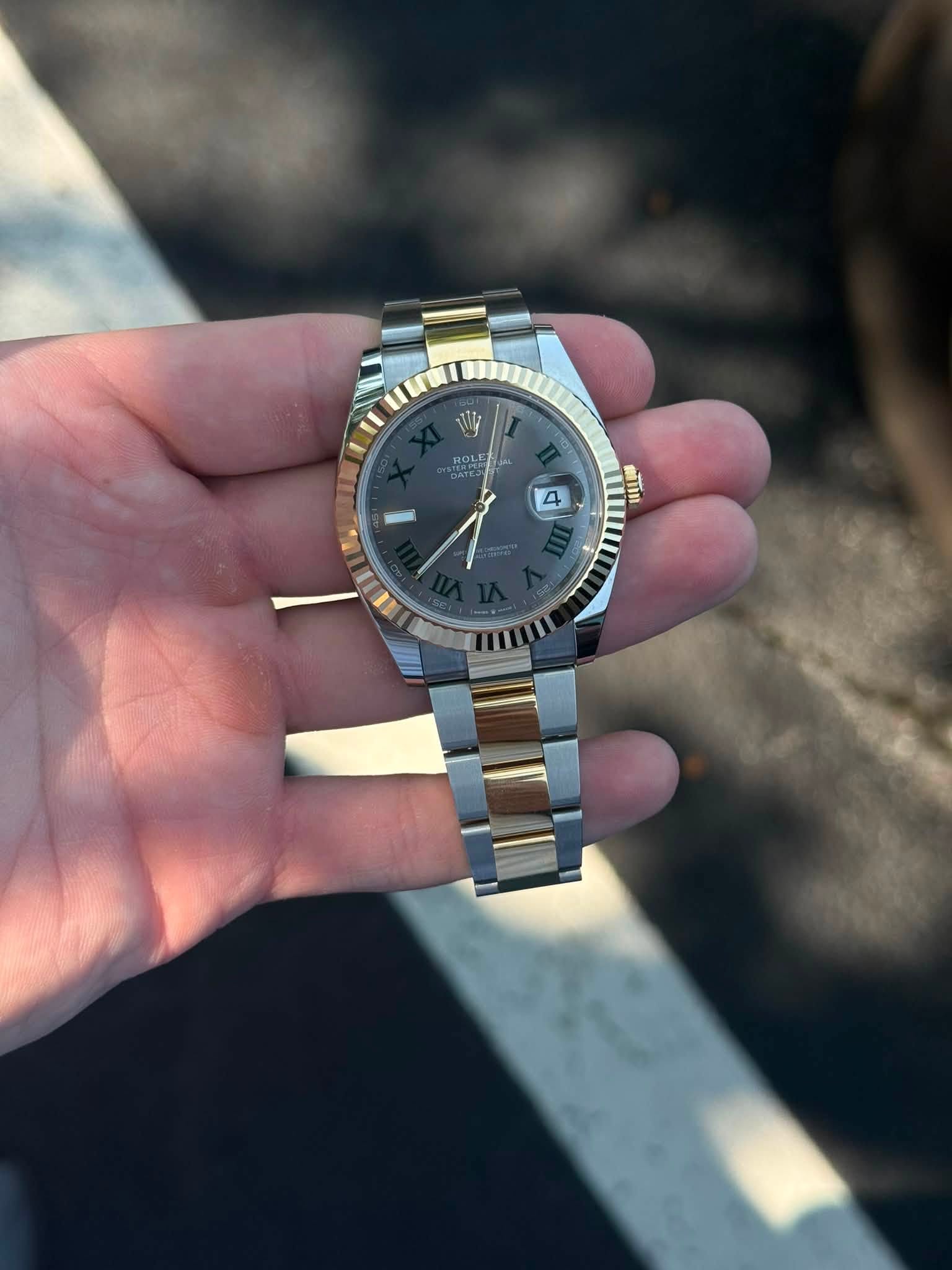 May be an image of wrist watch and text that says 'ROLE ROLE 4 4 三 «йTи'