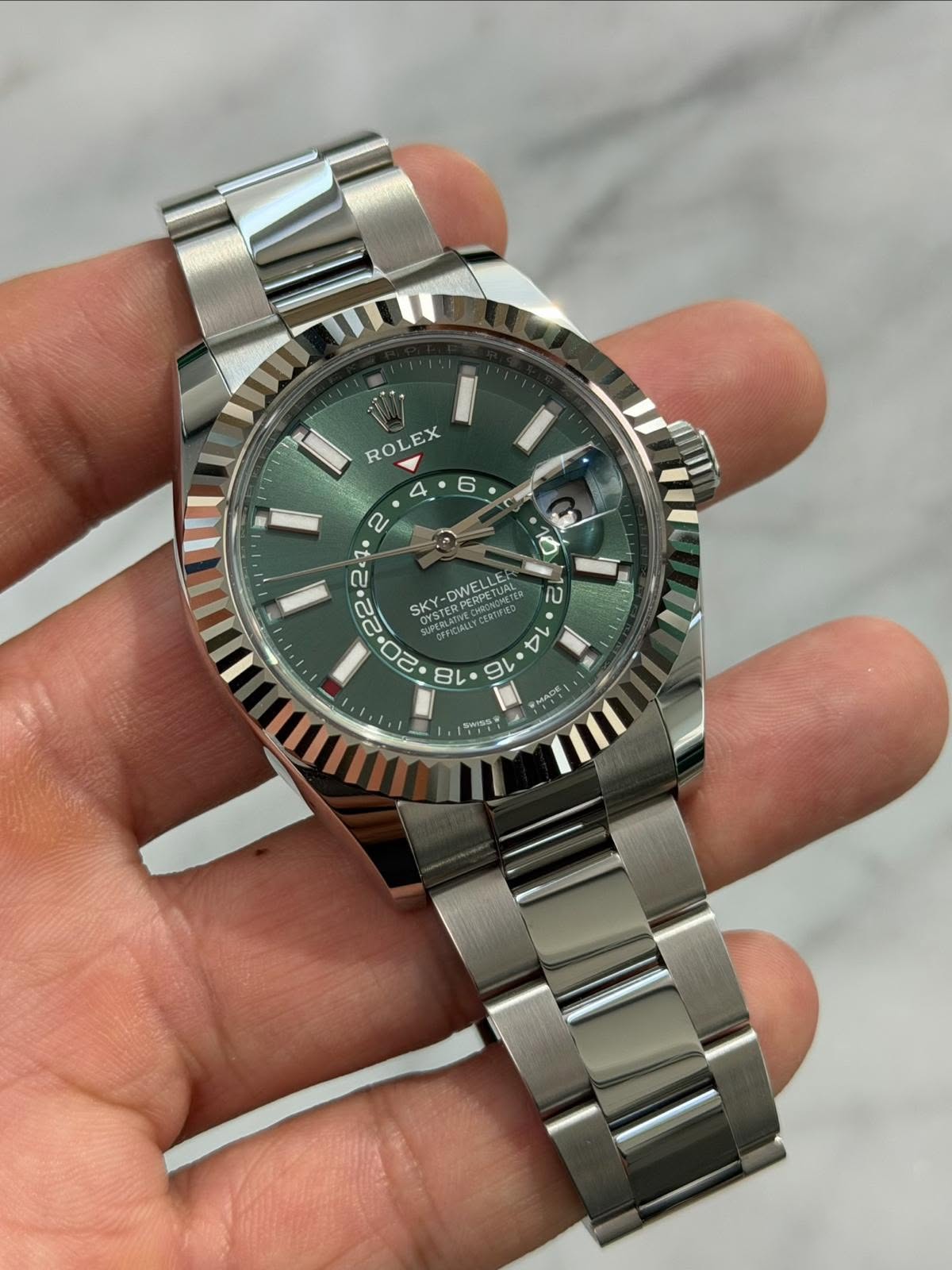 May be an image of wrist watch and text
