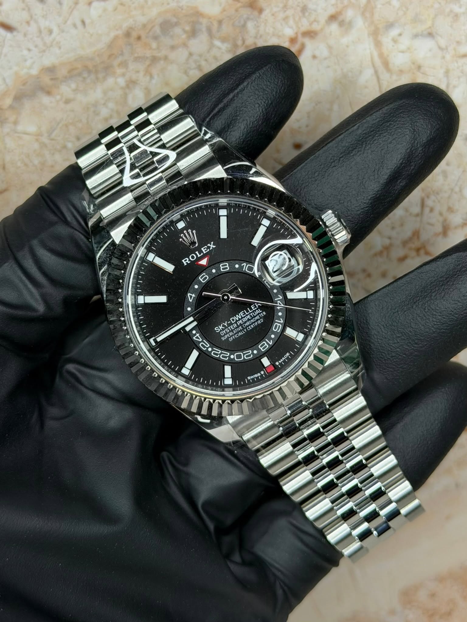 May be an image of wrist watch and text