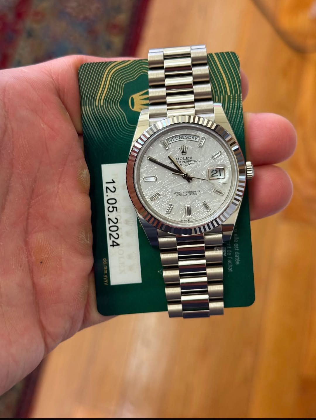 May be an image of wrist watch and text