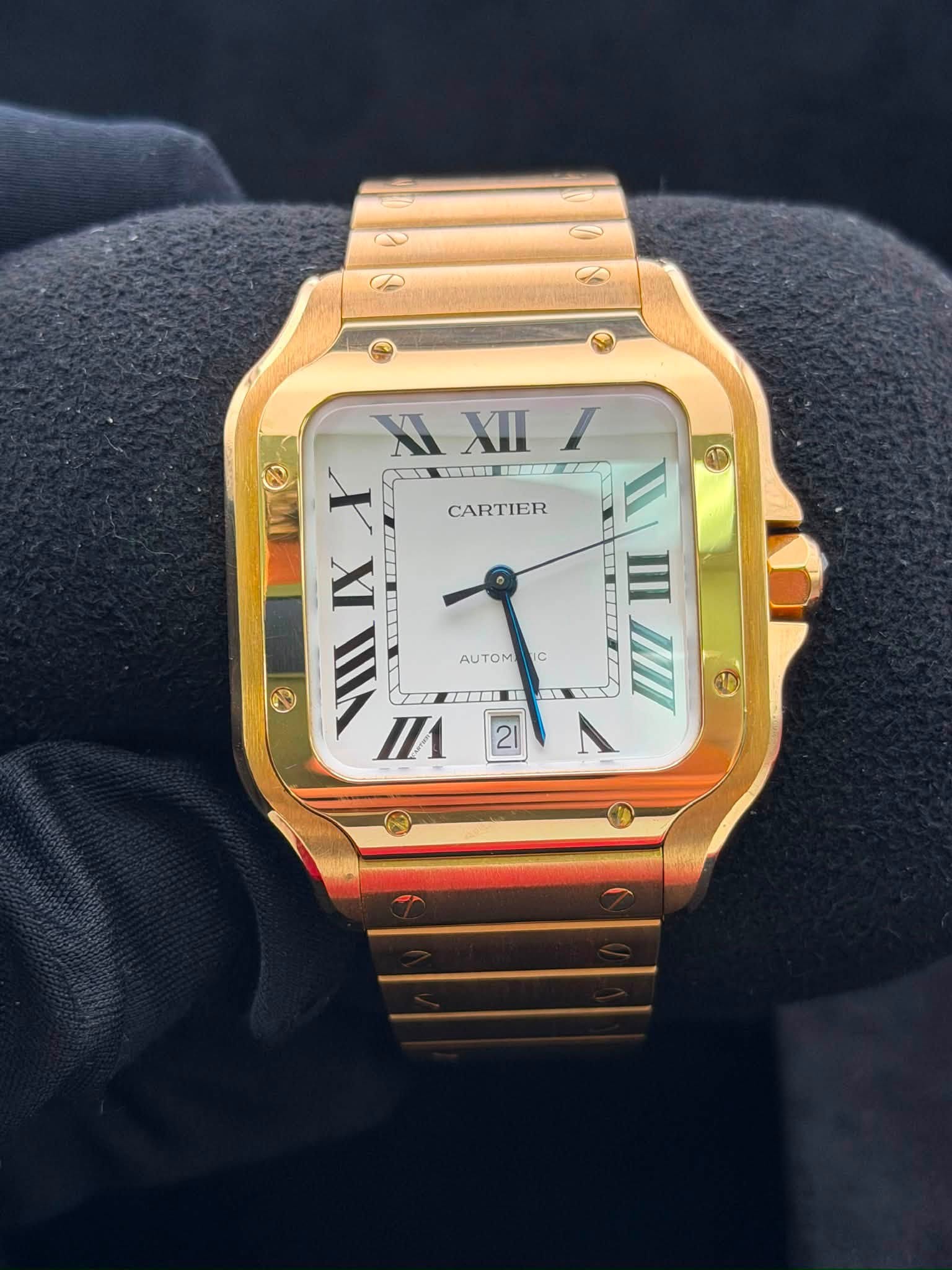 May be an image of wrist watch and text