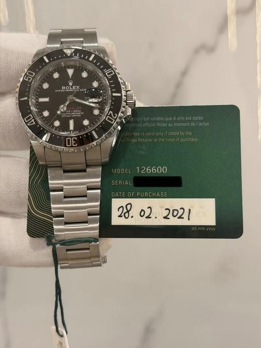 May be an image of wrist watch and text that says '50 ROLE ROLEX 10 4O '
