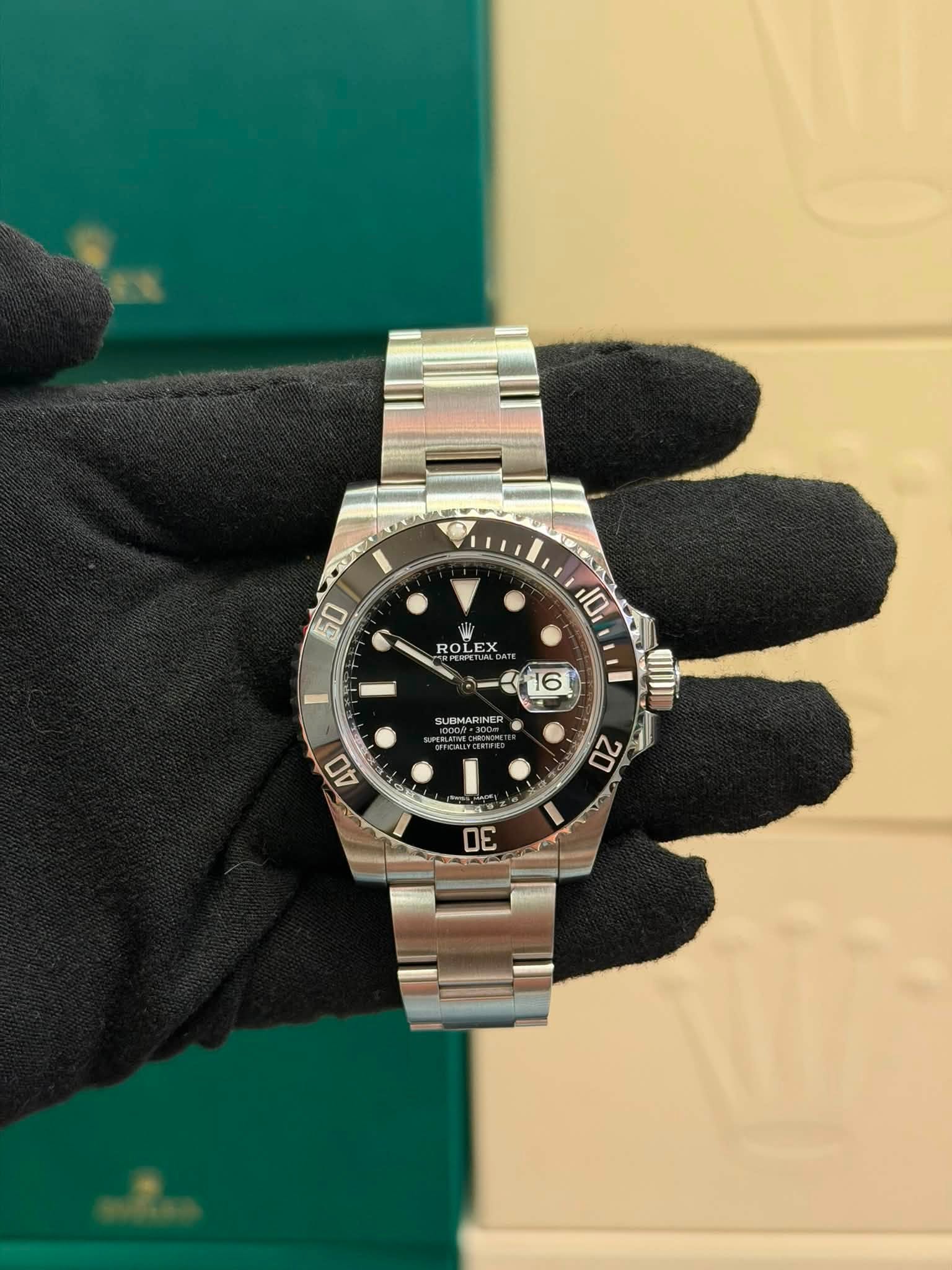 May be an image of wrist watch and text that says '50 W ROLEX 10 16 SUBMARINER ER UPERLATY 40 20 30'