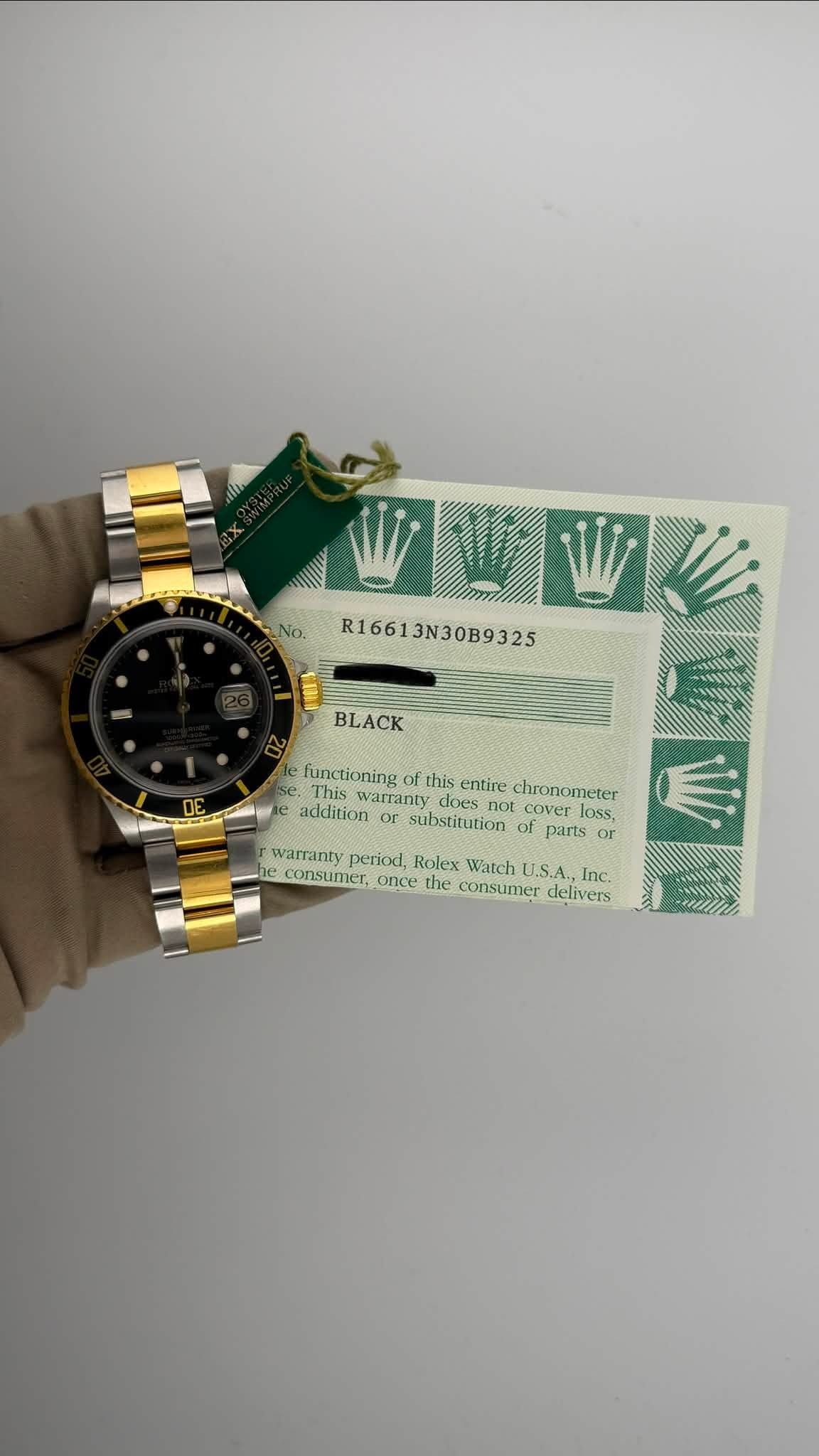 May be an image of money, wrist watch and text that says 'No. R16613N30B9325 BLACK functioning this entire chronometer This warranty does addition cover loss substitution of parts…