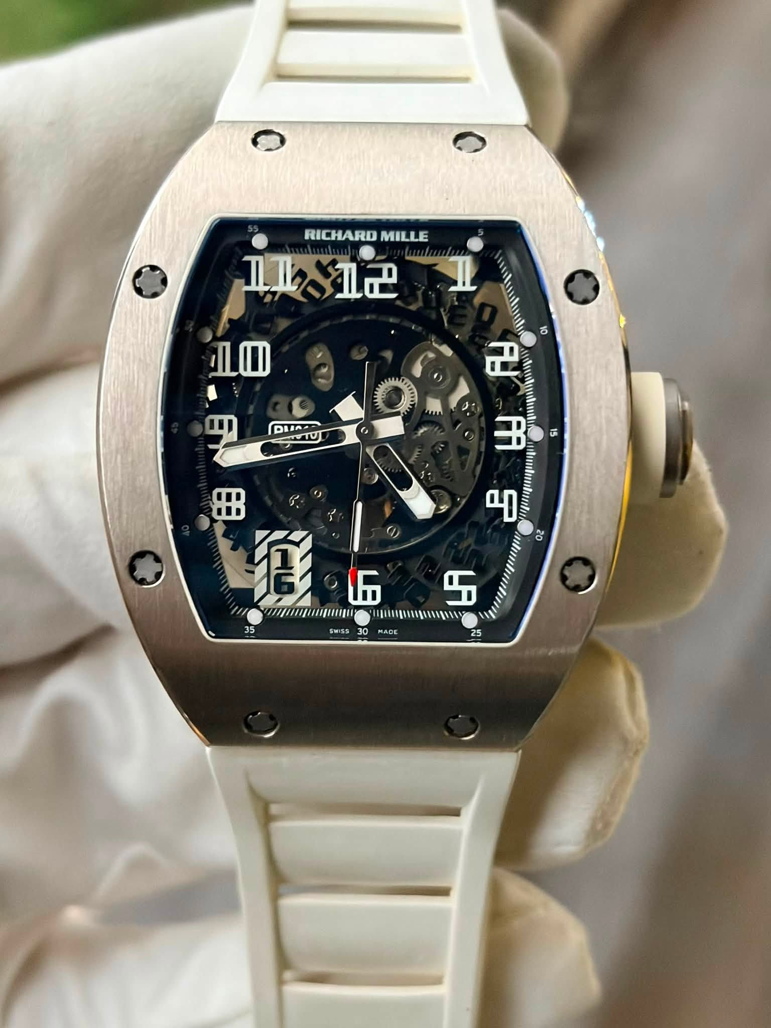 May be an image of wrist watch and text