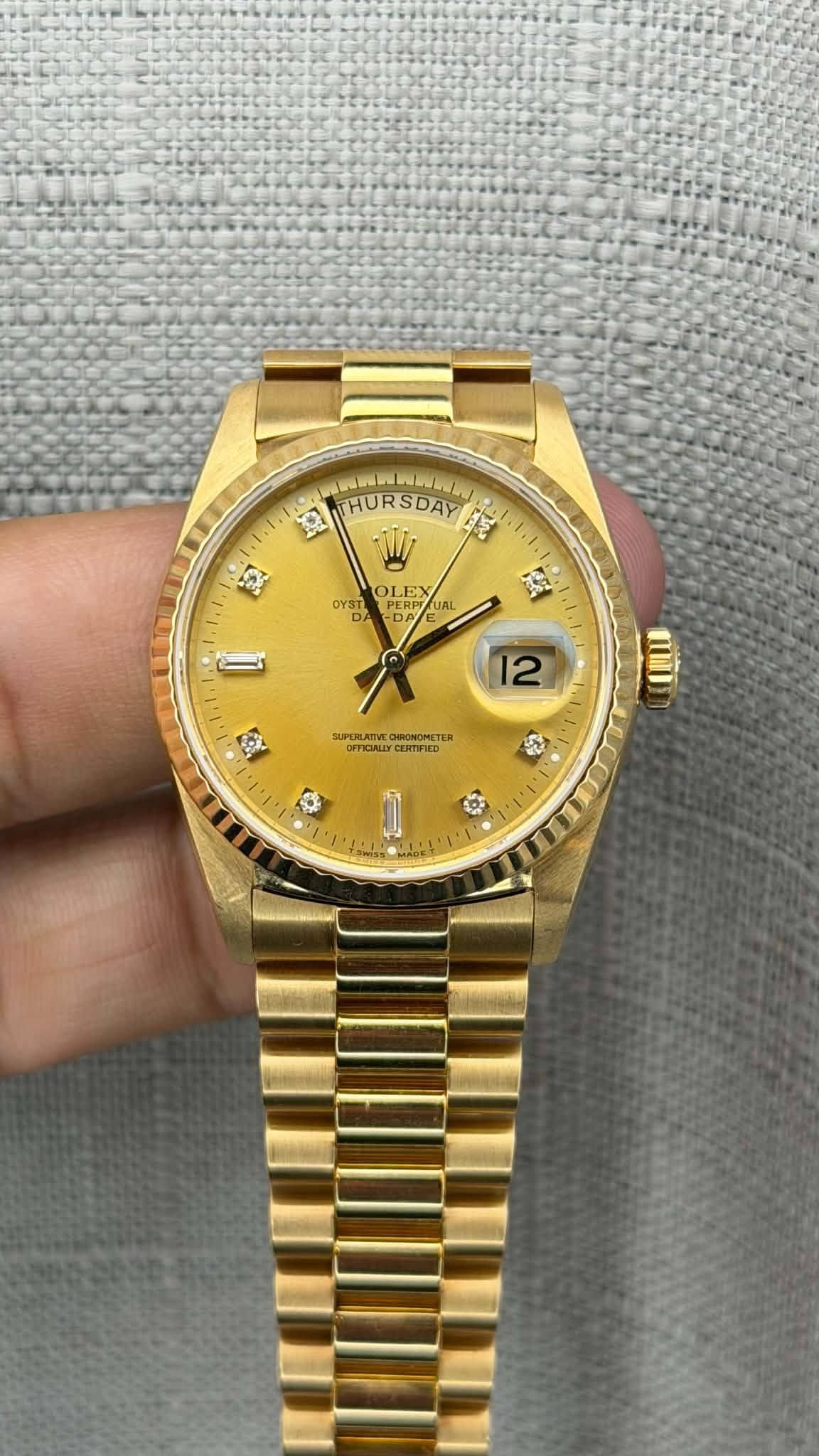 May be an image of wrist watch and text