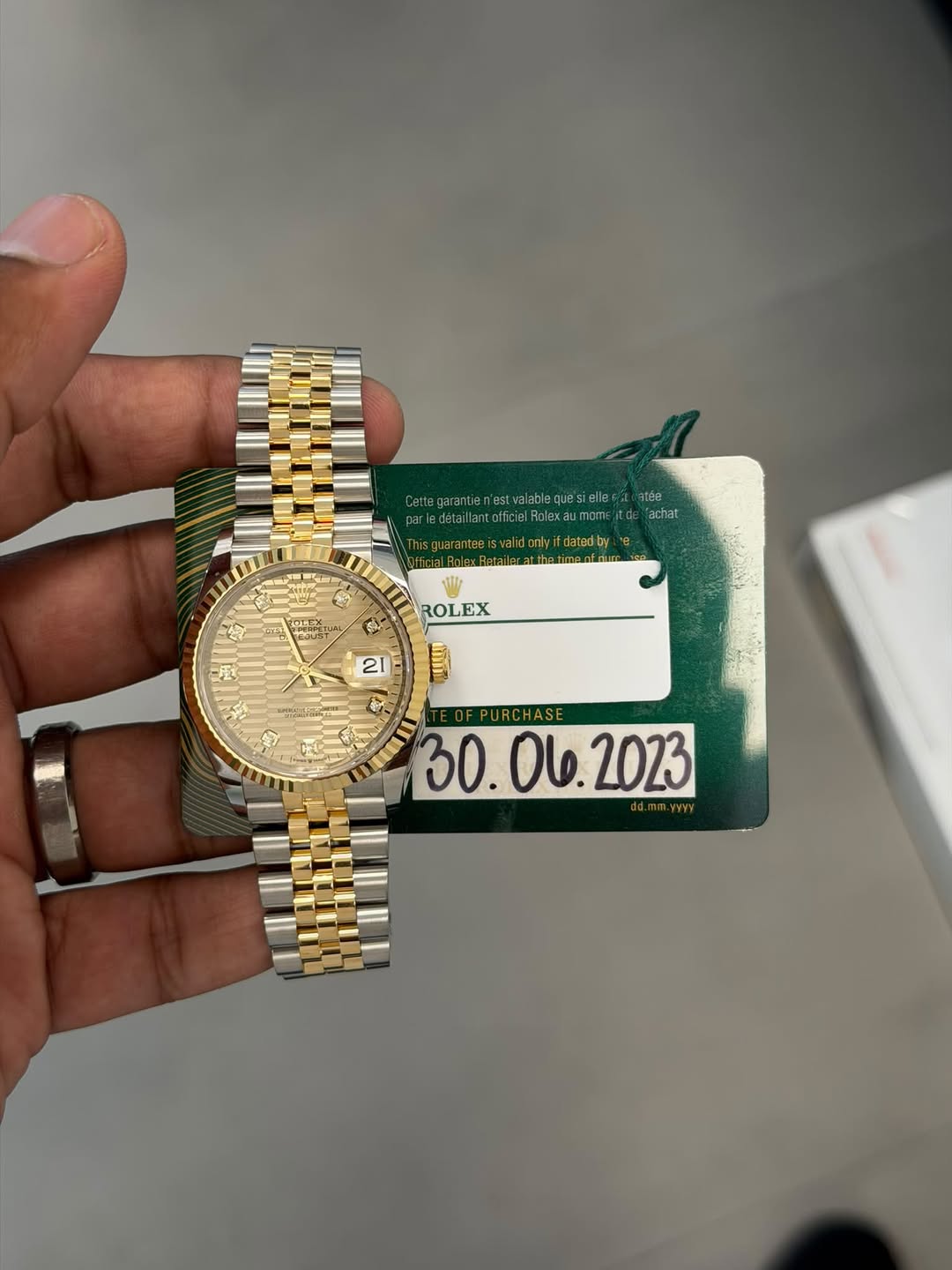 May be an image of wrist watch and text