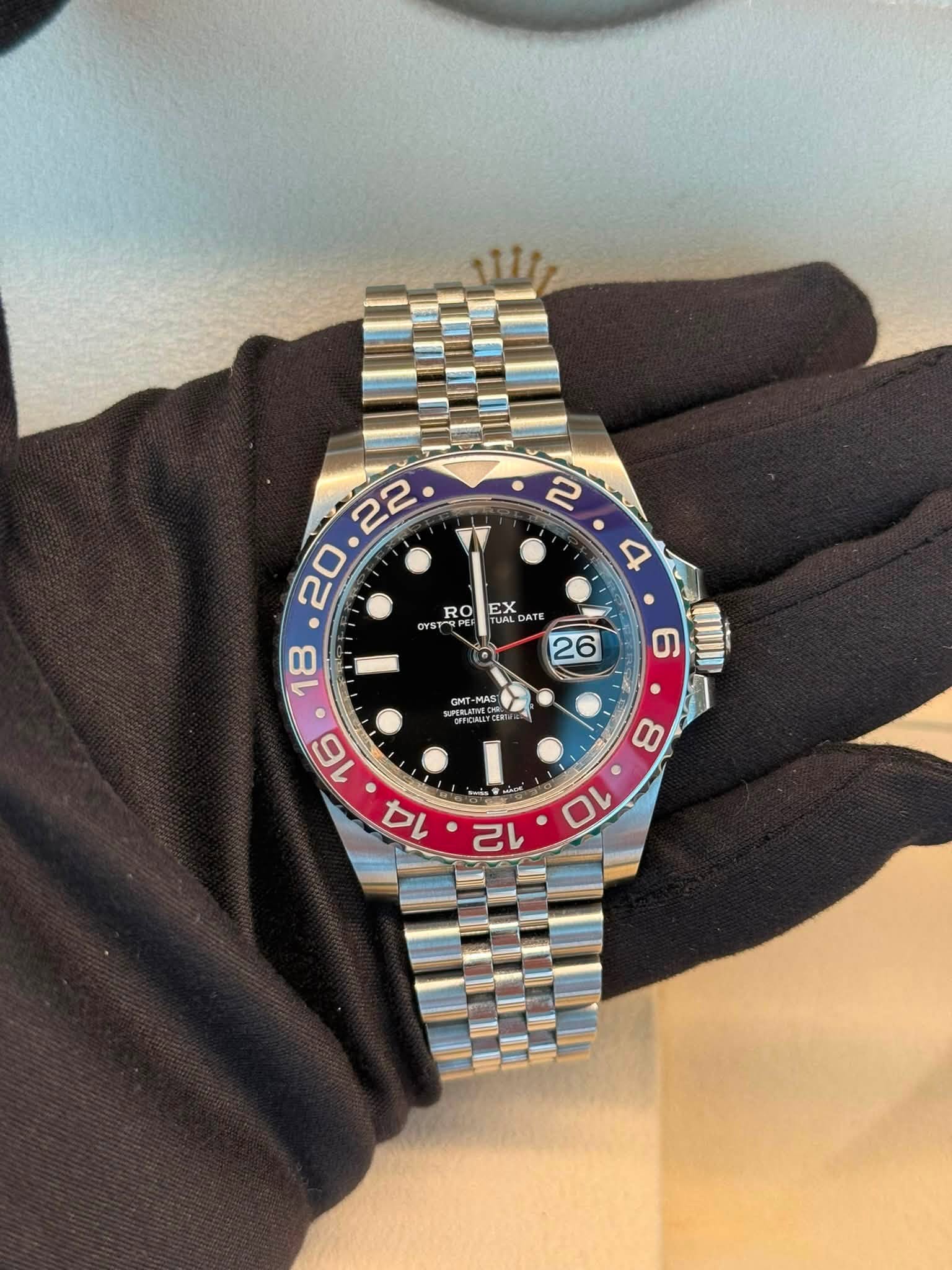 May be an image of wrist watch and text