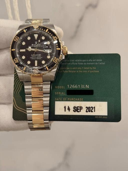 May be an image of wrist watch and text that says '50 10 ROLEX SUGNARINE 40 0Z 126613LN 14SEP2021 14 SEP 2021'