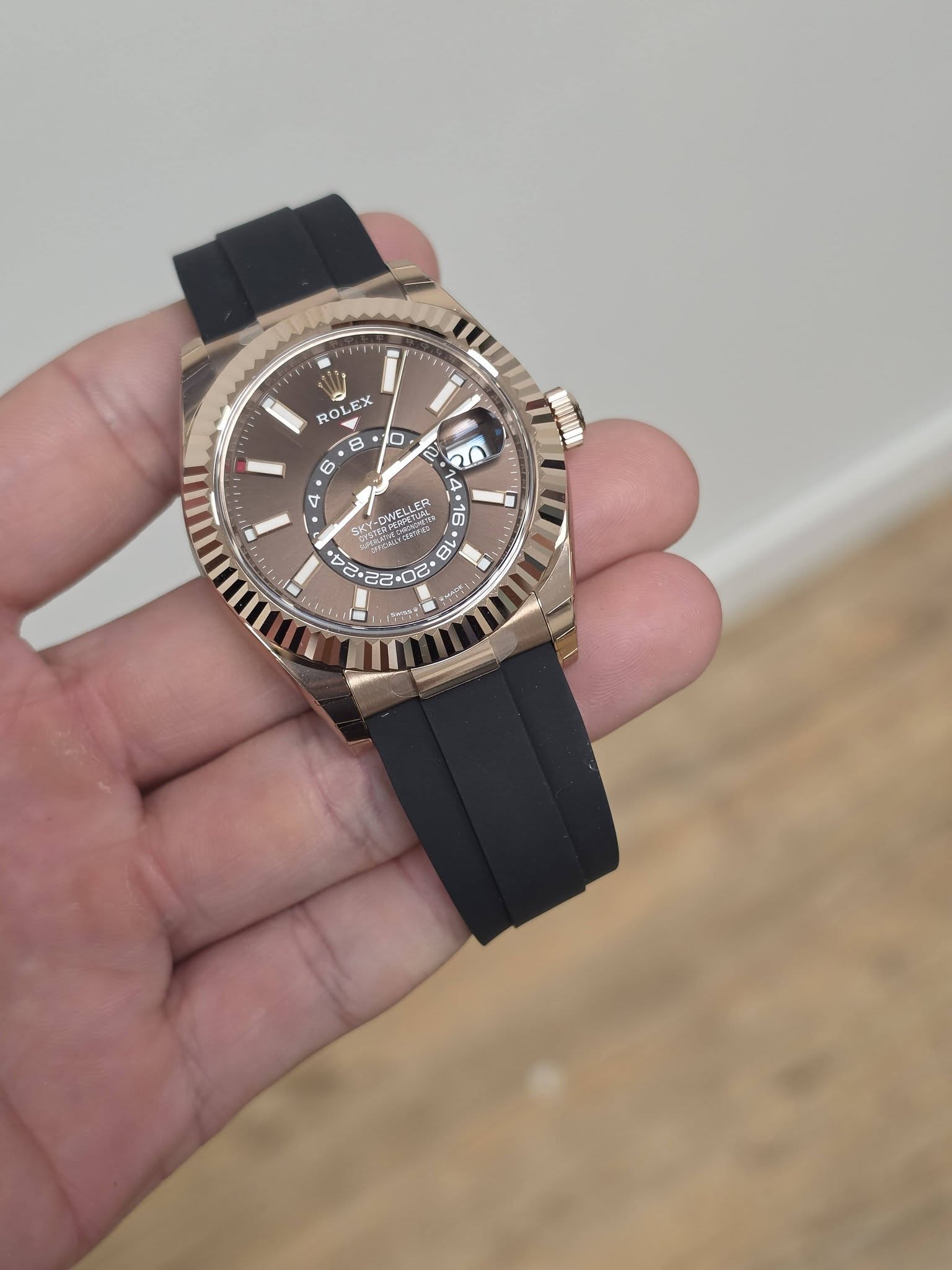 May be an image of wrist watch and text