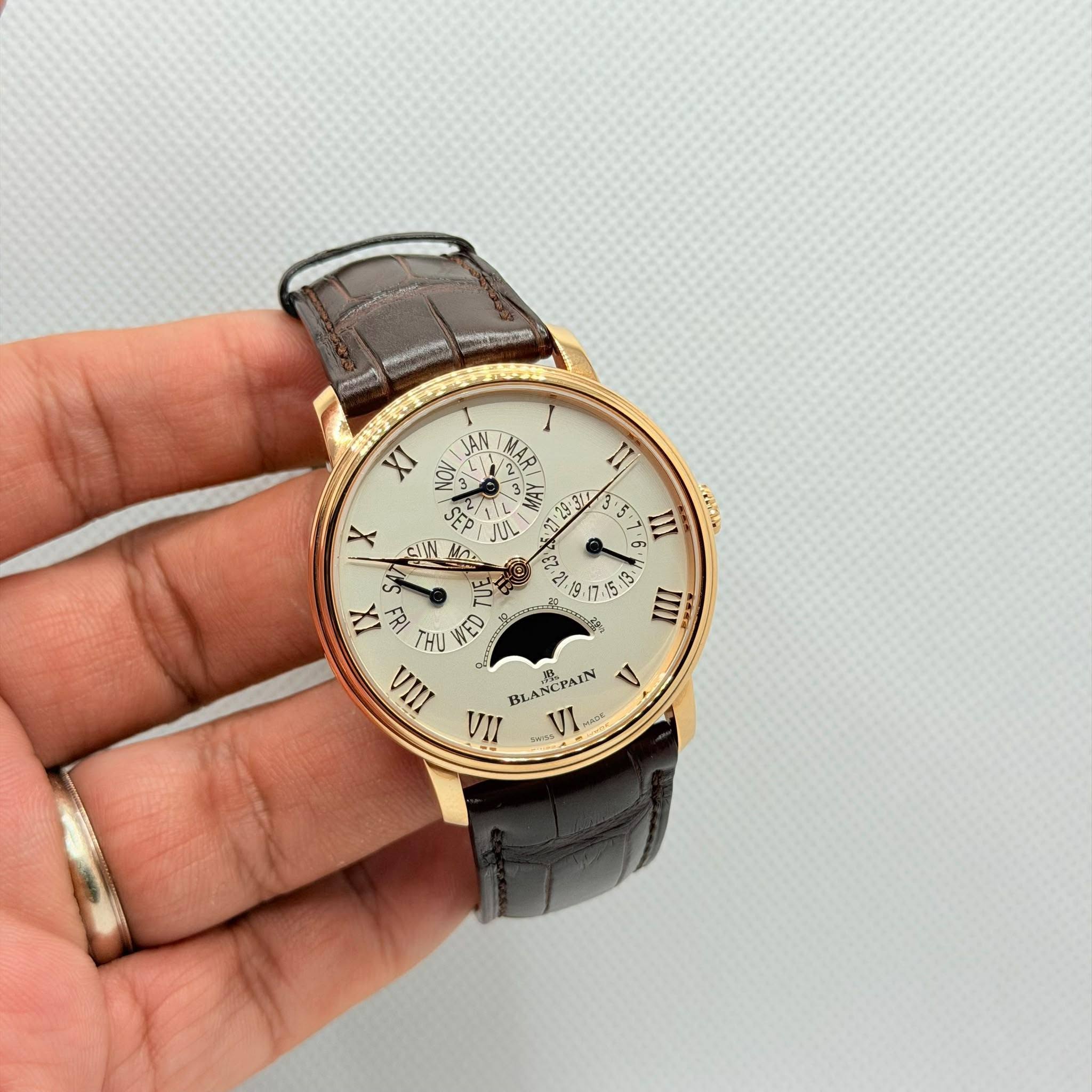 May be an image of wrist watch and text