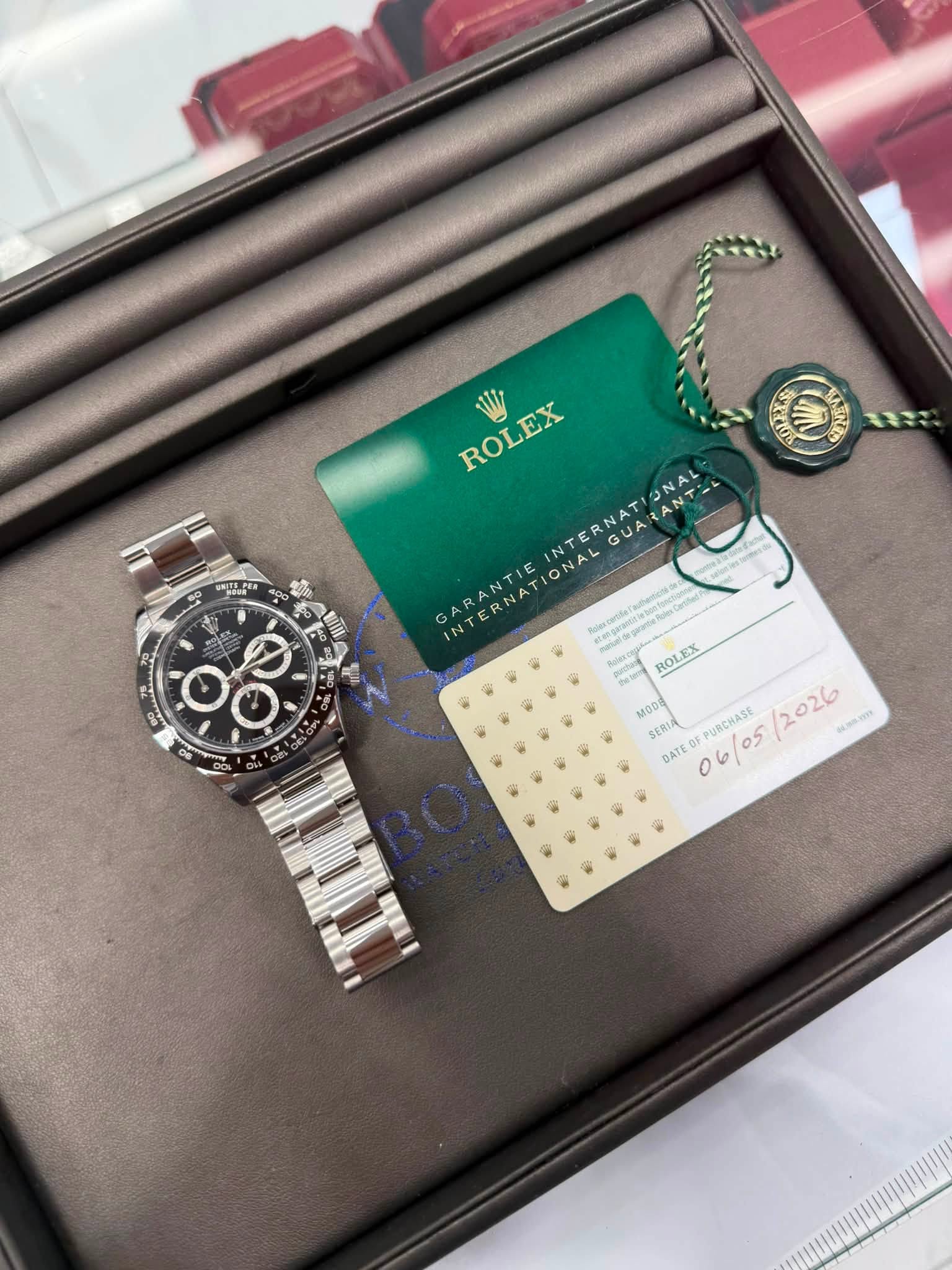 May be an image of wrist watch and text that says 'ROLEX ラ カ ARANT N GARANTIE に felexcode ROLEX 1e MODI SERIA PURCHASE 05 2026 1ammma DATE 6 6'