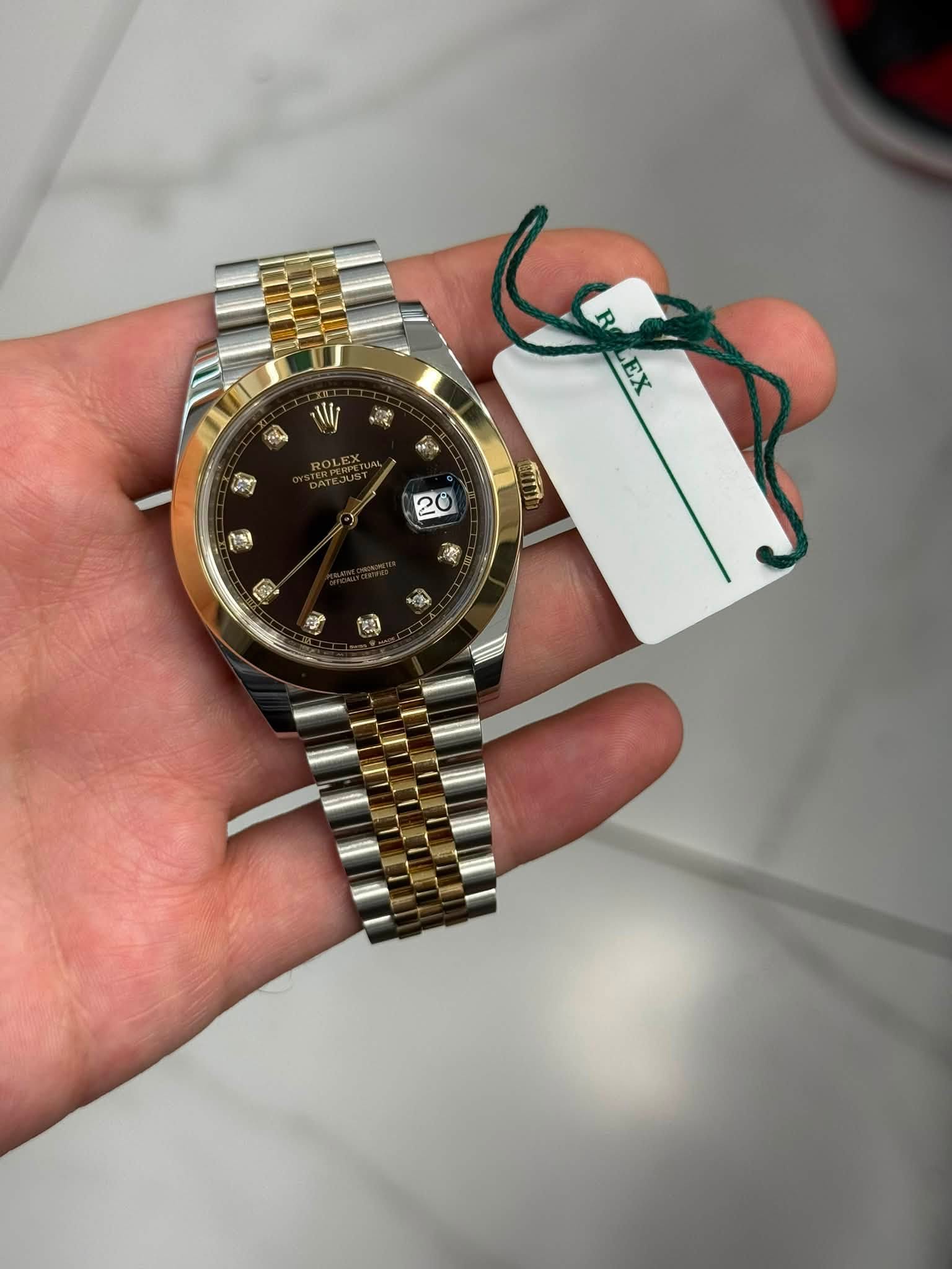 May be an image of wrist watch and text