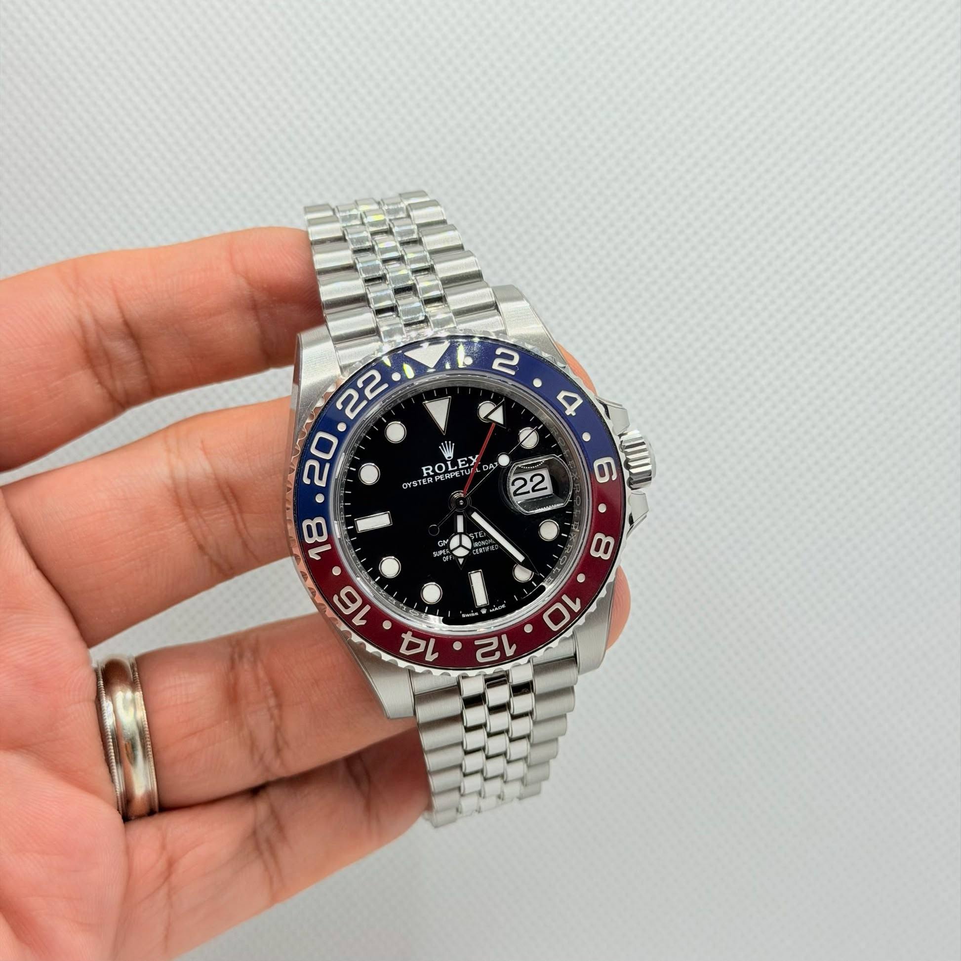 May be an image of wrist watch and text