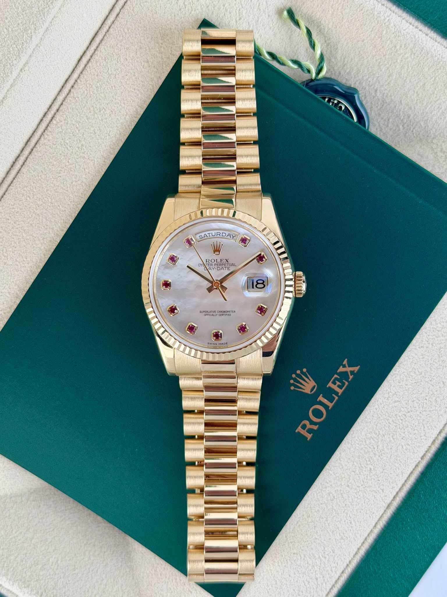 May be an image of wrist watch and text