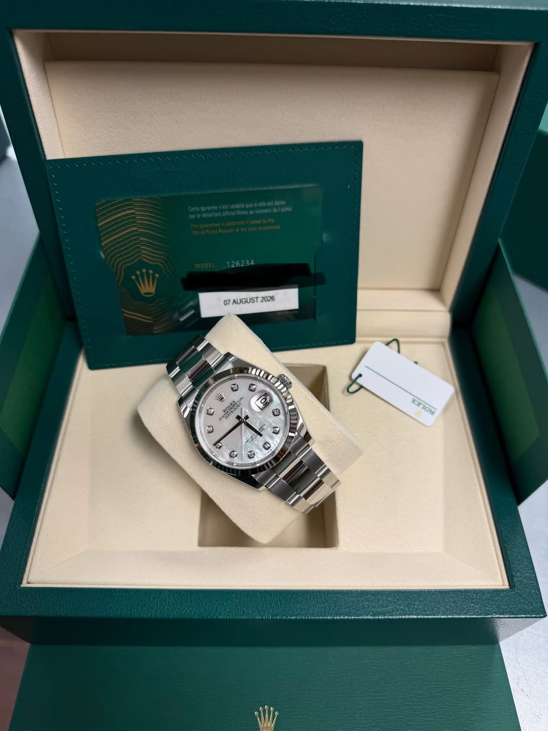 May be an image of wrist watch and text
