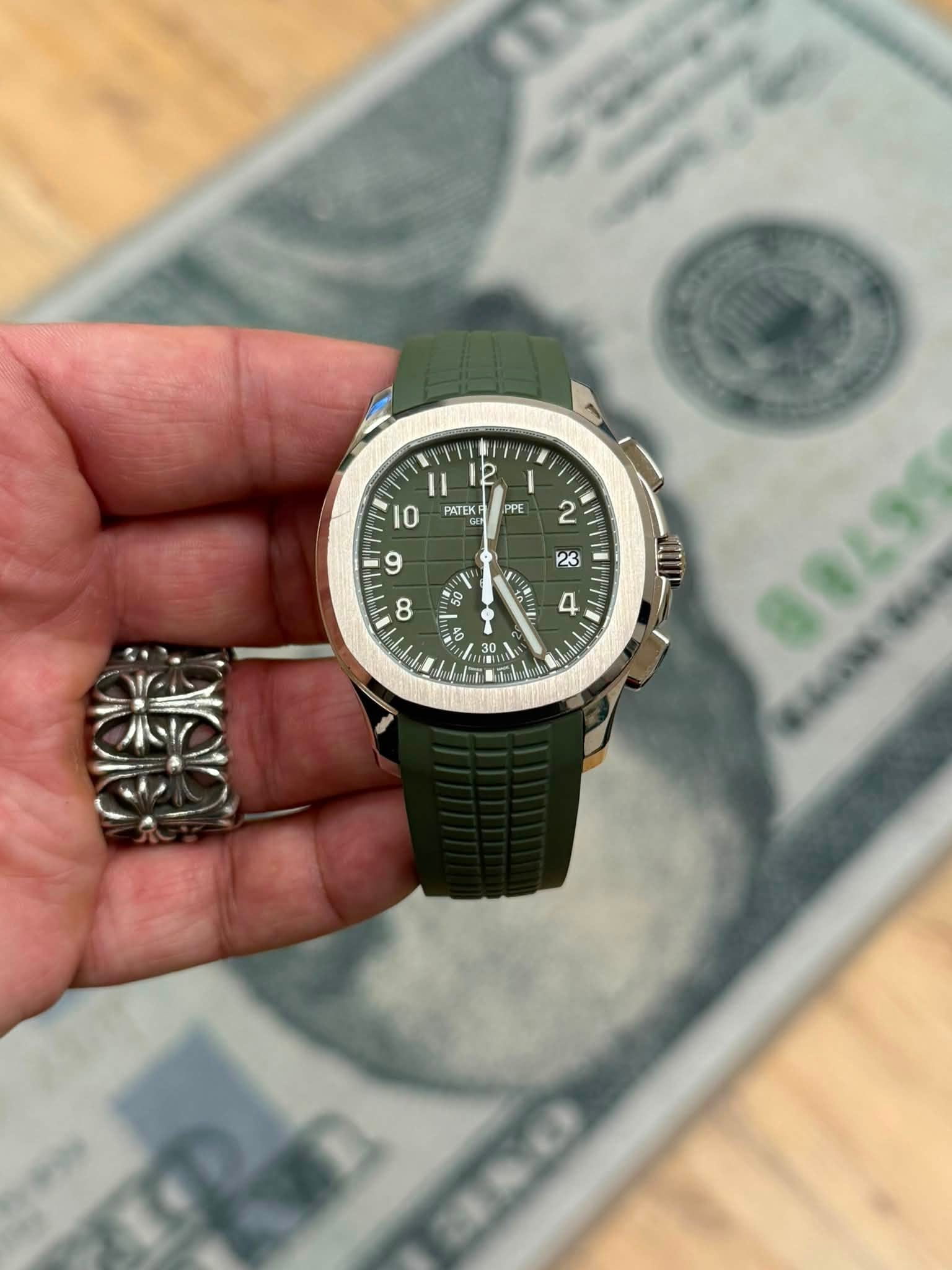 May be an image of wrist watch and text that says '2 I PPE PATEK IO 2 9 ج ١ G0 8 1 4 9 T 5 0 3 / TU 30 30 0'