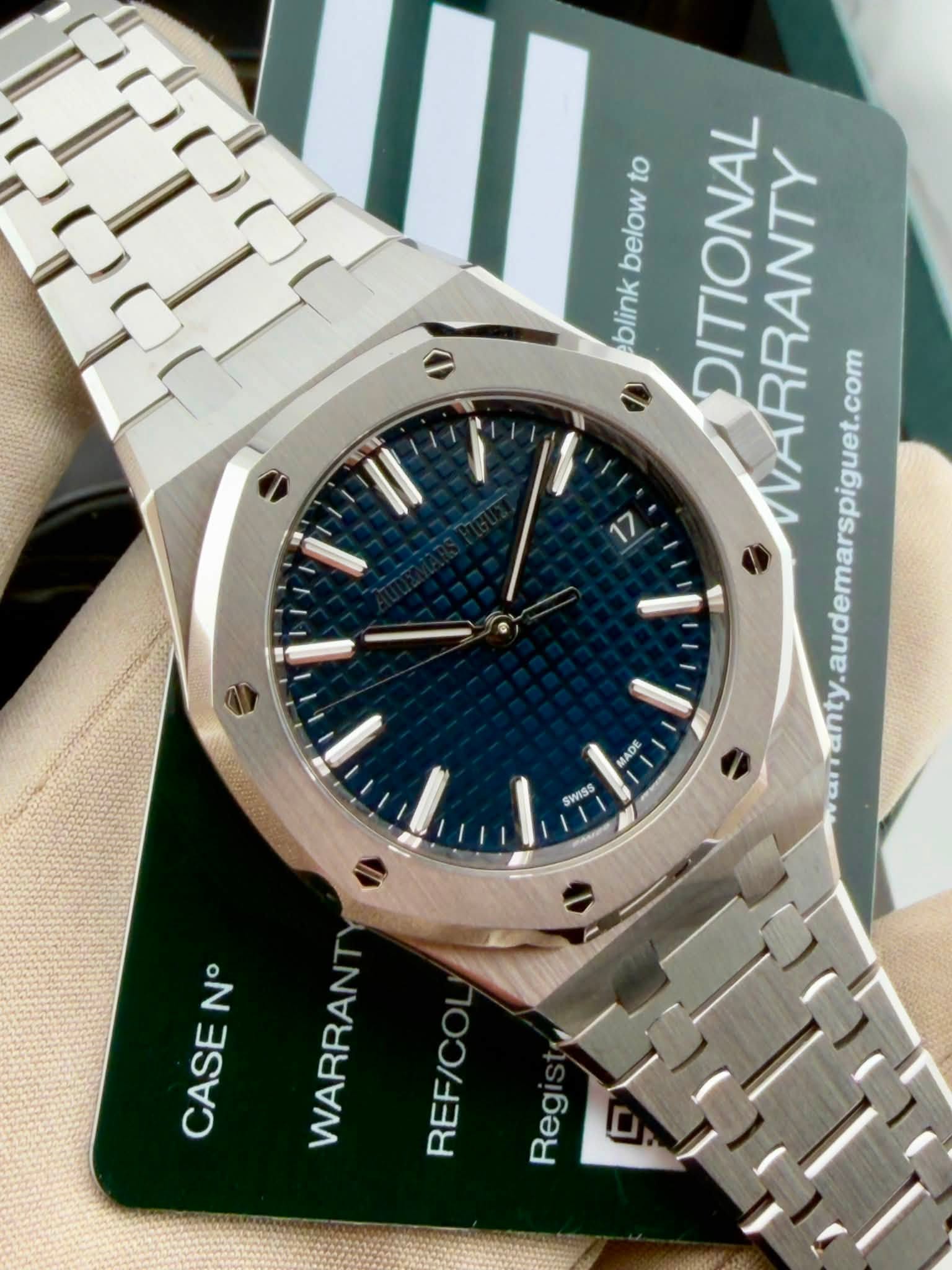 May be an image of wrist watch and text that says 'below to below DITIONAL WARRANTY y.audemarspiguet.com blink ADE SWISS NΒ° CASE WARRANT REF/C Reg'