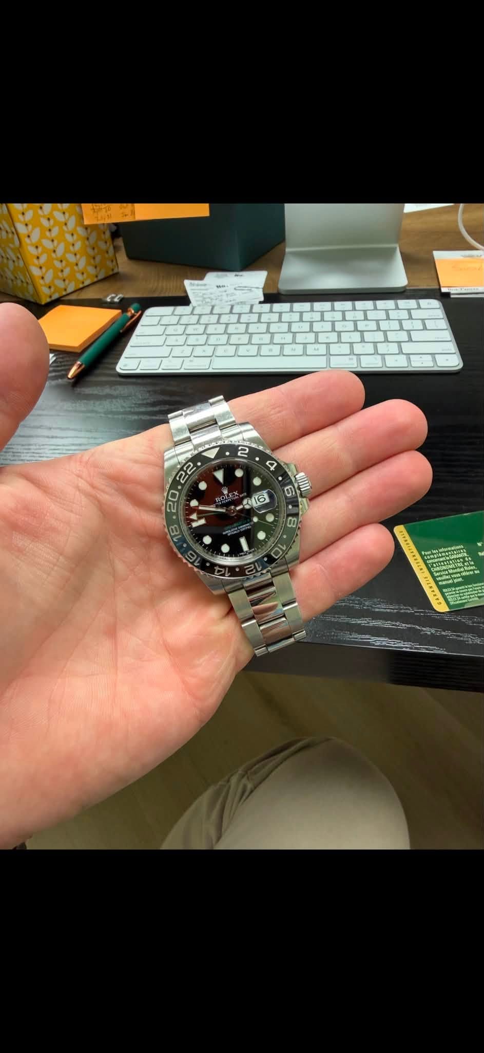 May be an image of wrist watch and text