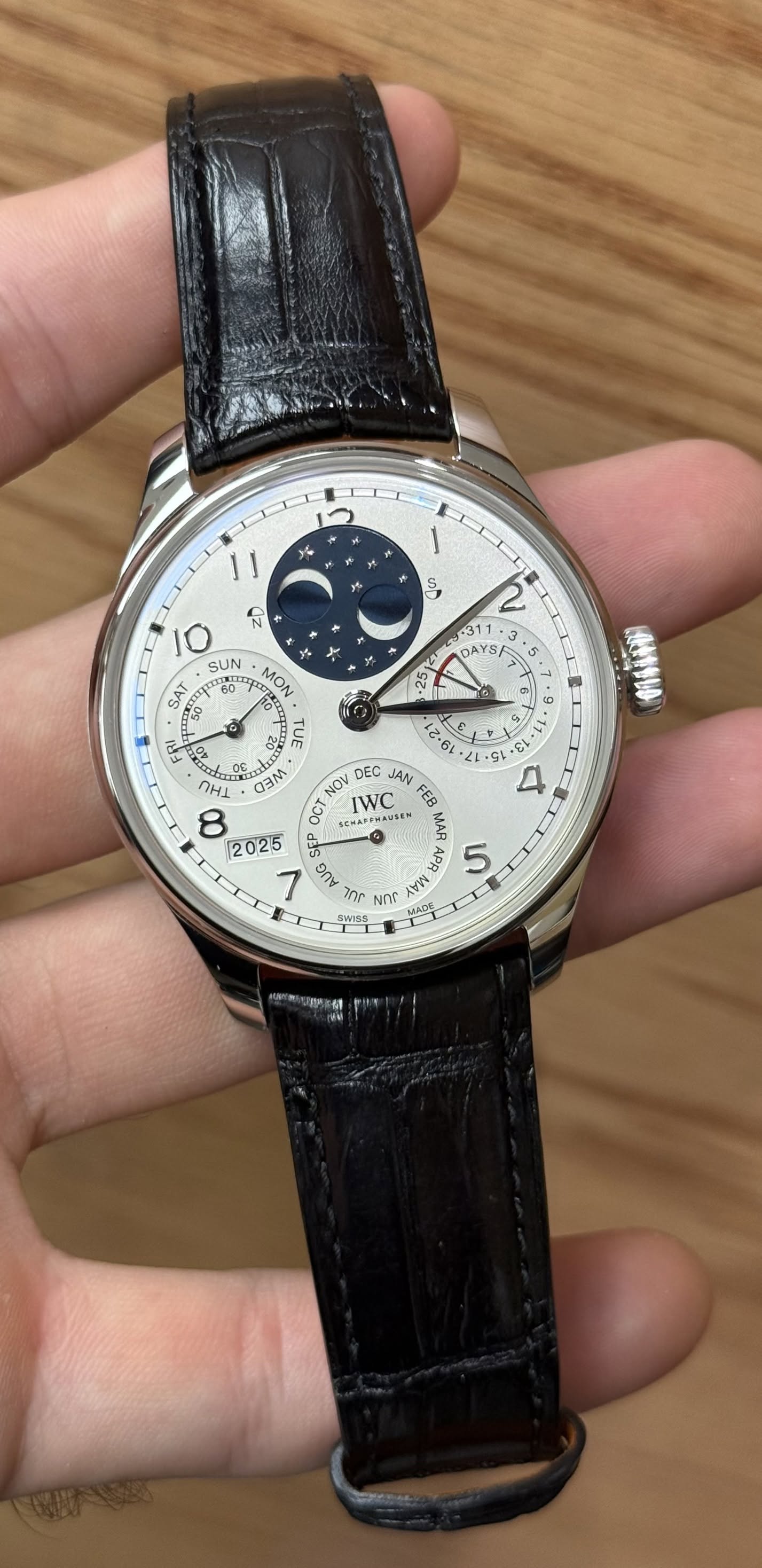 May be an image of wrist watch and text
