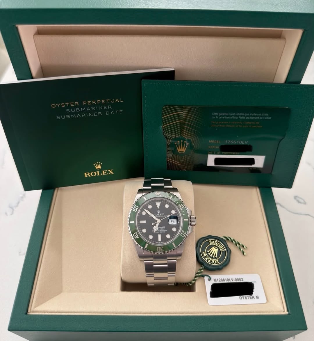 May be an image of wrist watch and text that says 'مفلل ROLE ROLEX EX 50 OLEx 10 JO S 5 1L לי 22 AO DE AVSNED K אורב ETOL M126610LV- M126610 OYSTERM M'