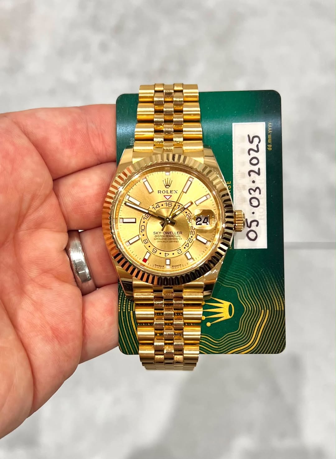 May be an image of wrist watch and text